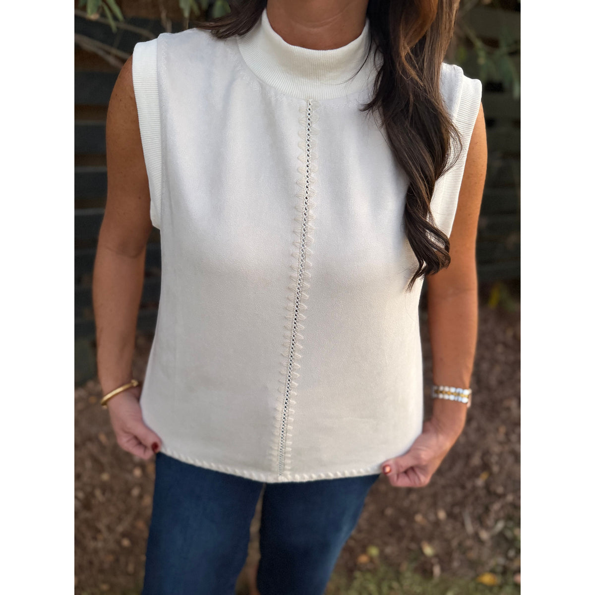 Annie Ks Boutique THML cream sleeveless suede top with mock neck and vertical accent stitching detail