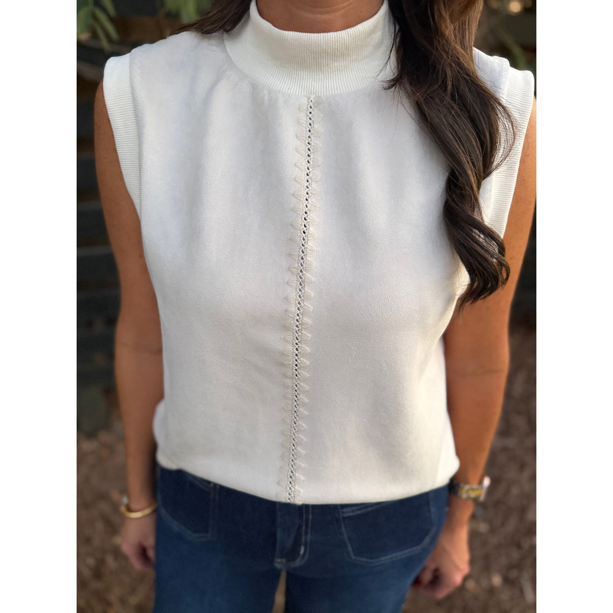 Annie Ks Boutique THML cream sleeveless suede top with mock neck and vertical decorative stitching detail