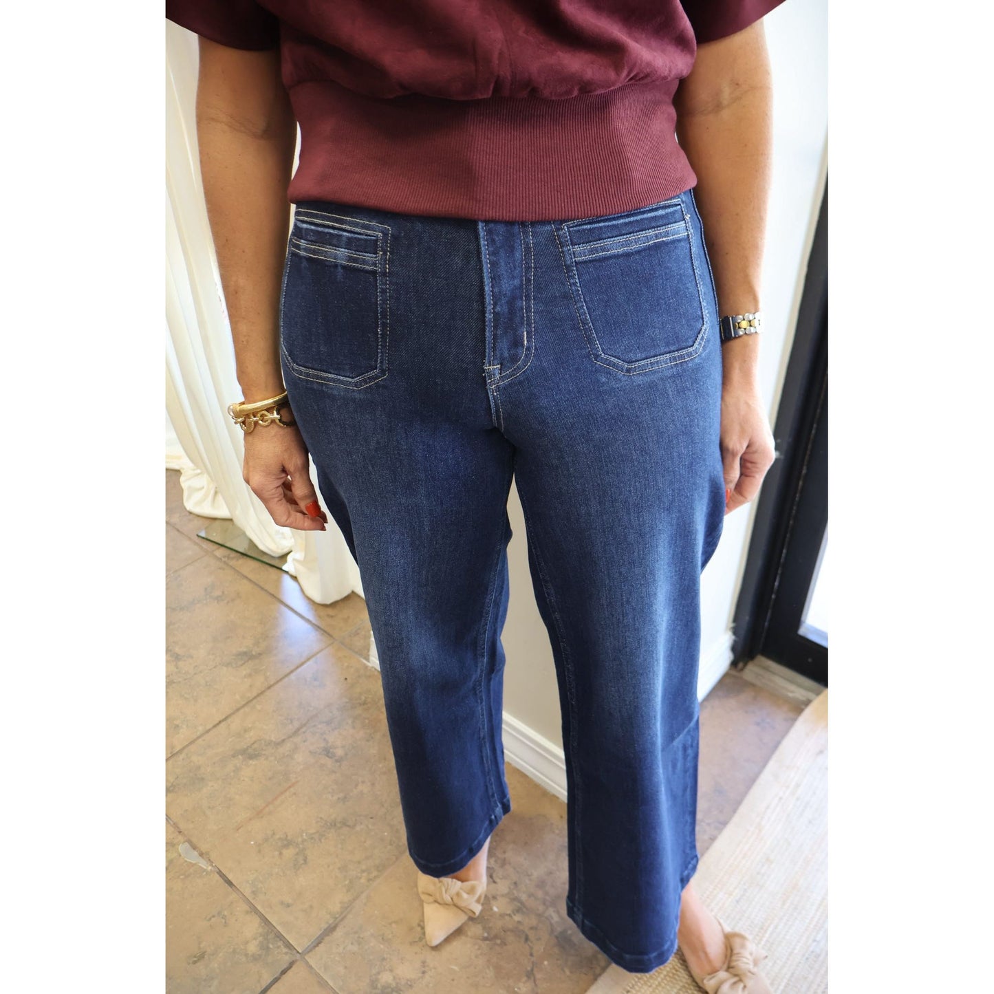 Annie Ks Boutique dark wash high-rise wide leg cropped jeans with front patch pockets worn with a maroon top