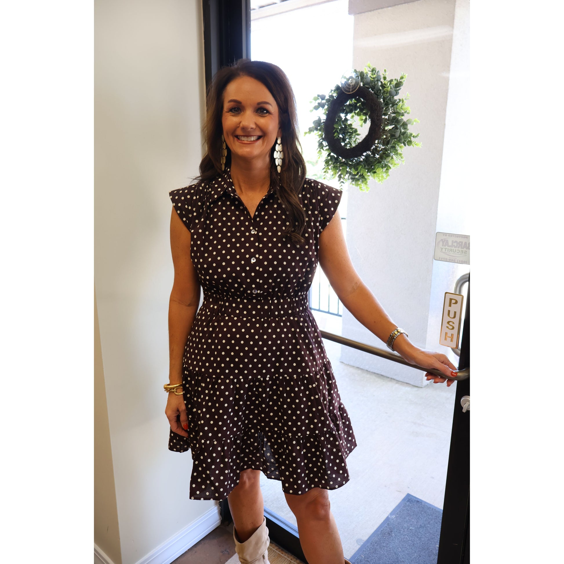Annie Ks Boutique espresso brown cotton mini dress with white polka dots, tiered skirt, collar, and cap sleeves.