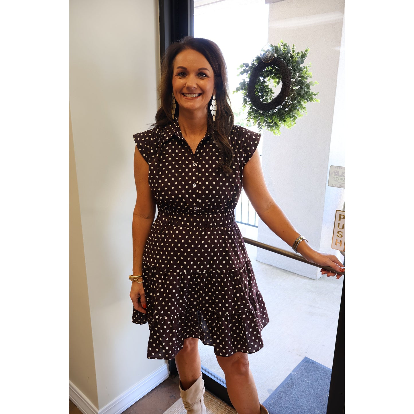 Annie Ks Boutique espresso brown cotton mini dress with white polka dots, tiered skirt, collar, and cap sleeves.