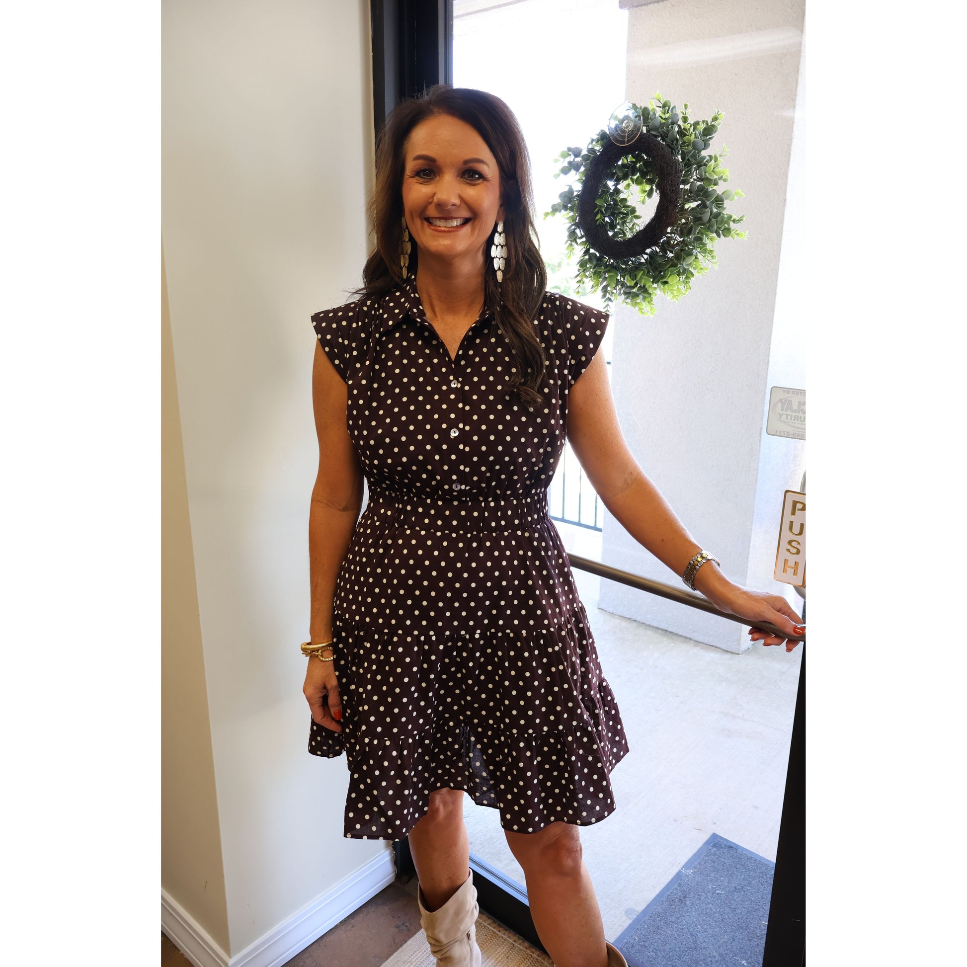 Annie Ks Boutique espresso brown cotton mini dress with white polka dots, tiered skirt, collar, and cap sleeves.