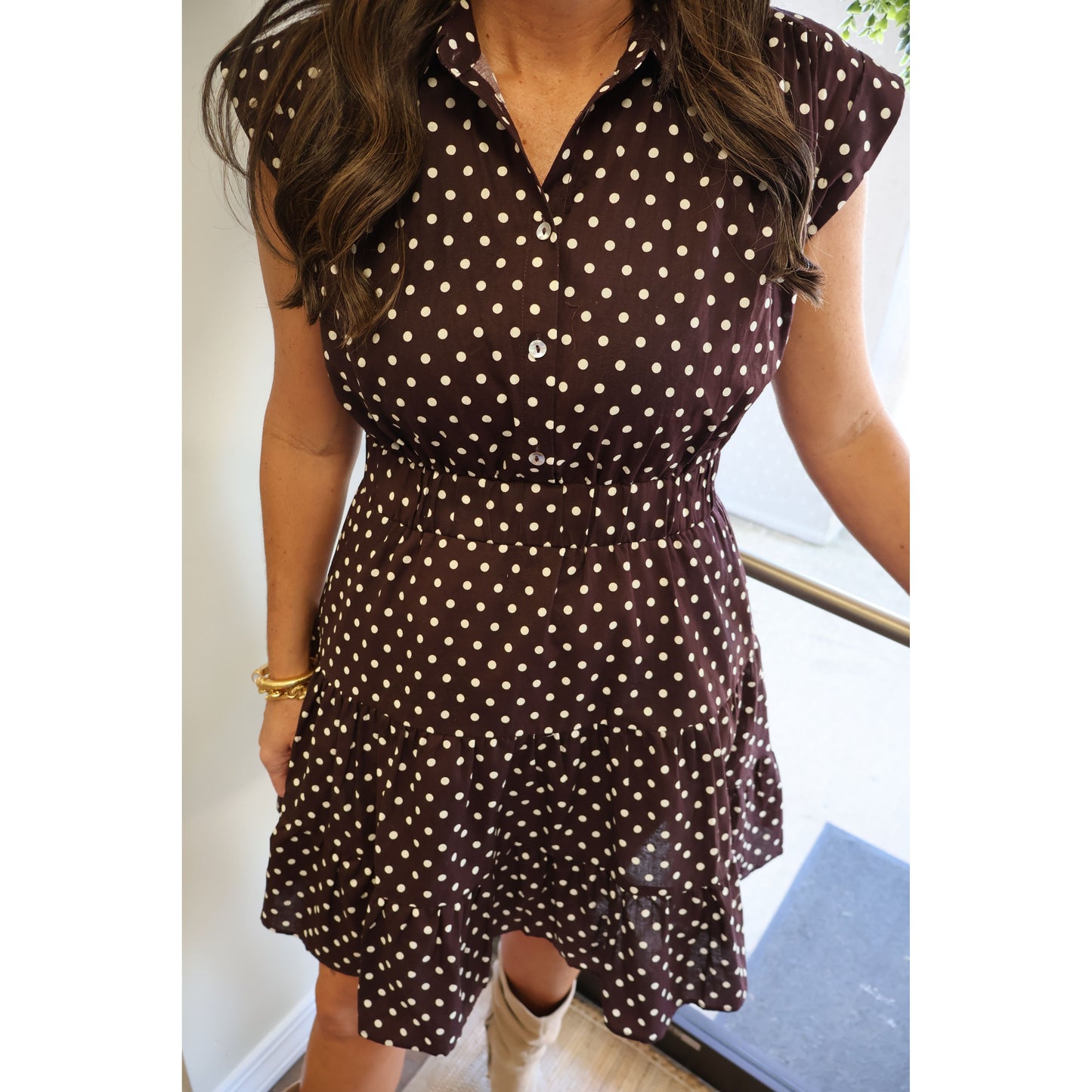 Annie Ks Boutique espresso brown cotton mini dress with white polka dots, collared neckline, and tiered skirt.