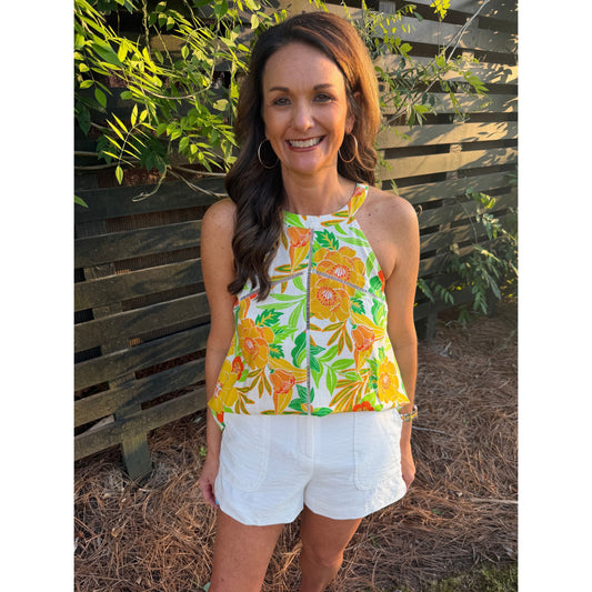 Annie Ks Boutique Island Sun Linen Halter top with yellow and green floral print, lace insets, and white shorts.