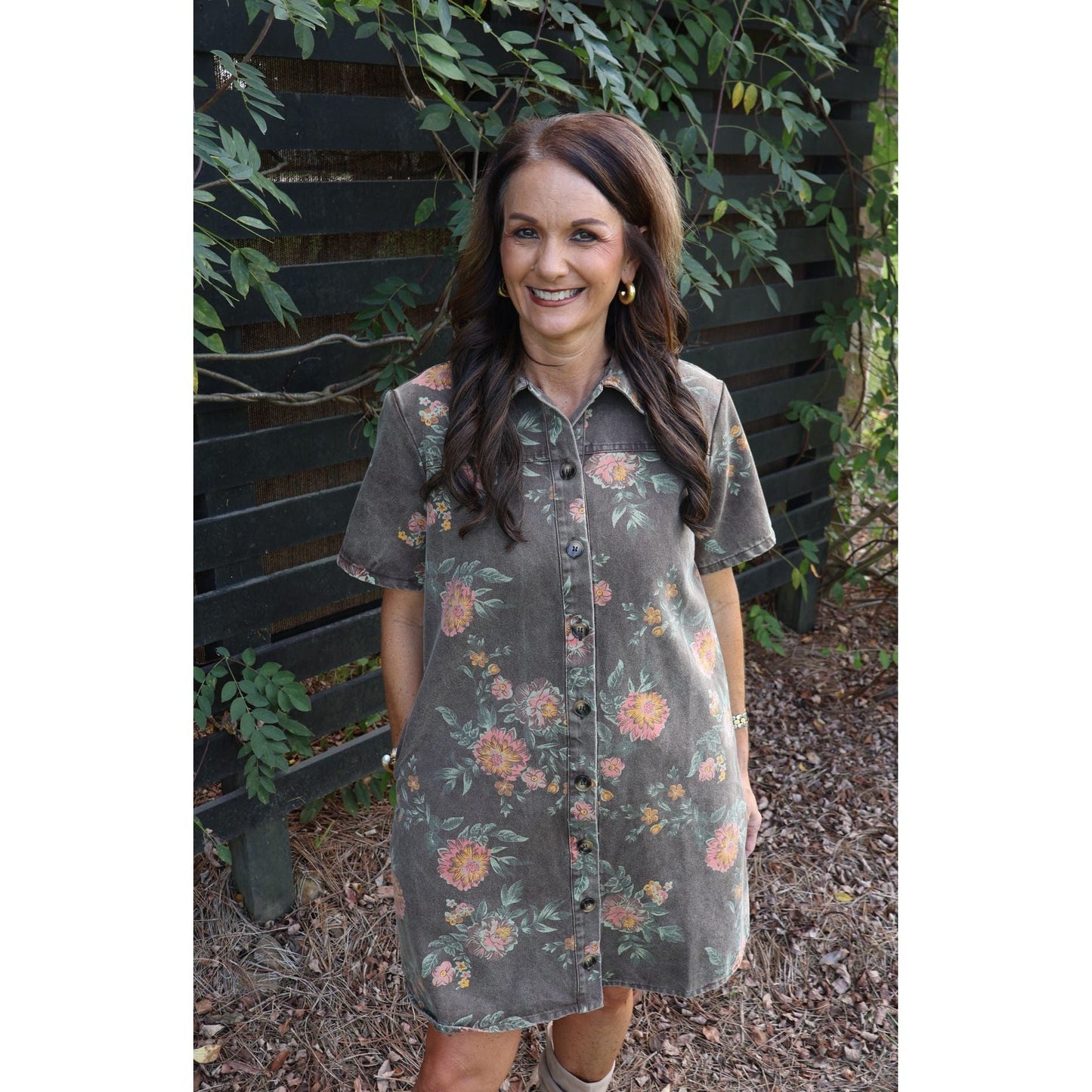 Annie Ks Boutique vintage wash floral shirt dress with a collared button-down front and short sleeves on a woman.