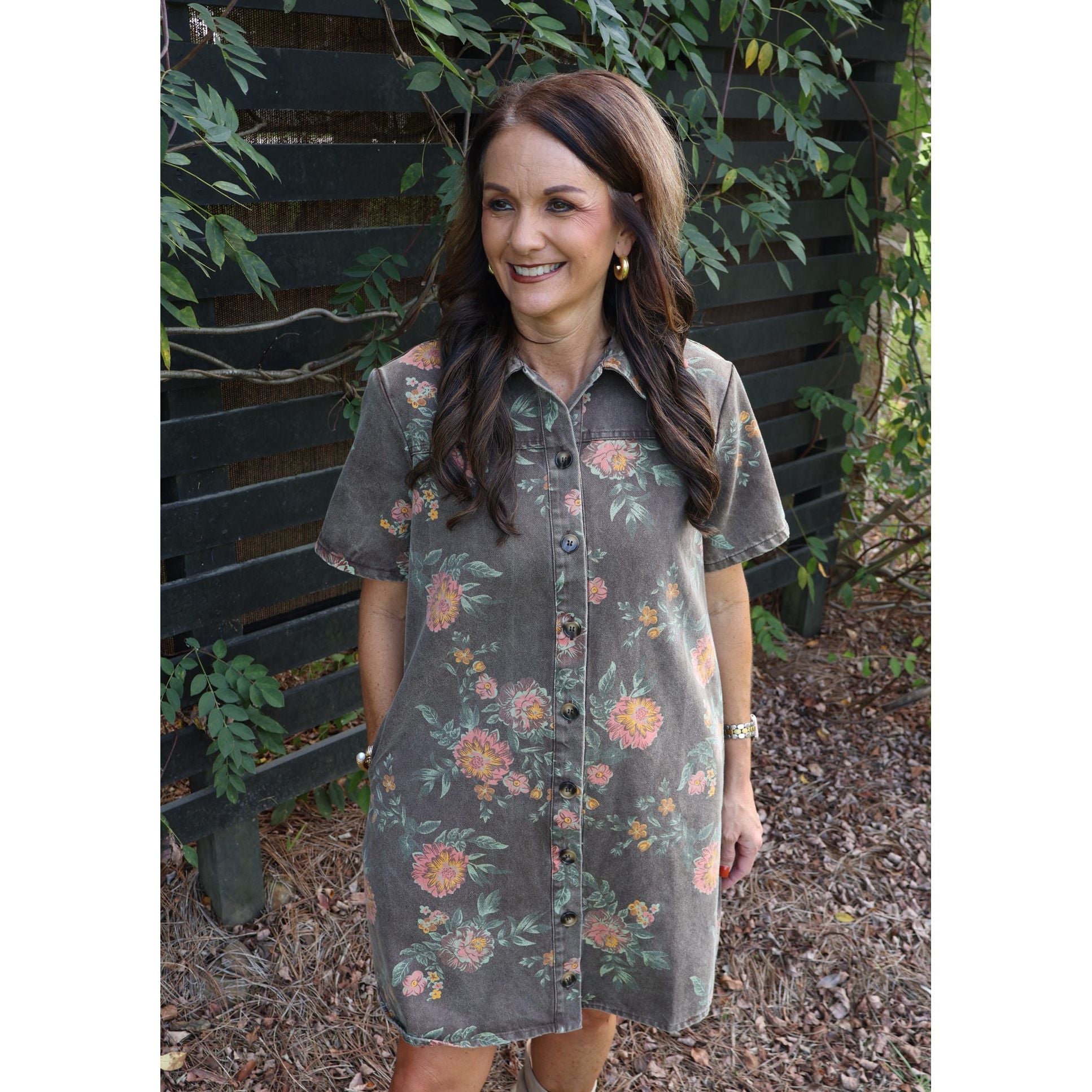 Annie Ks Boutique vintage wash floral shirt dress with collar, button-down front, and pockets on a smiling woman.