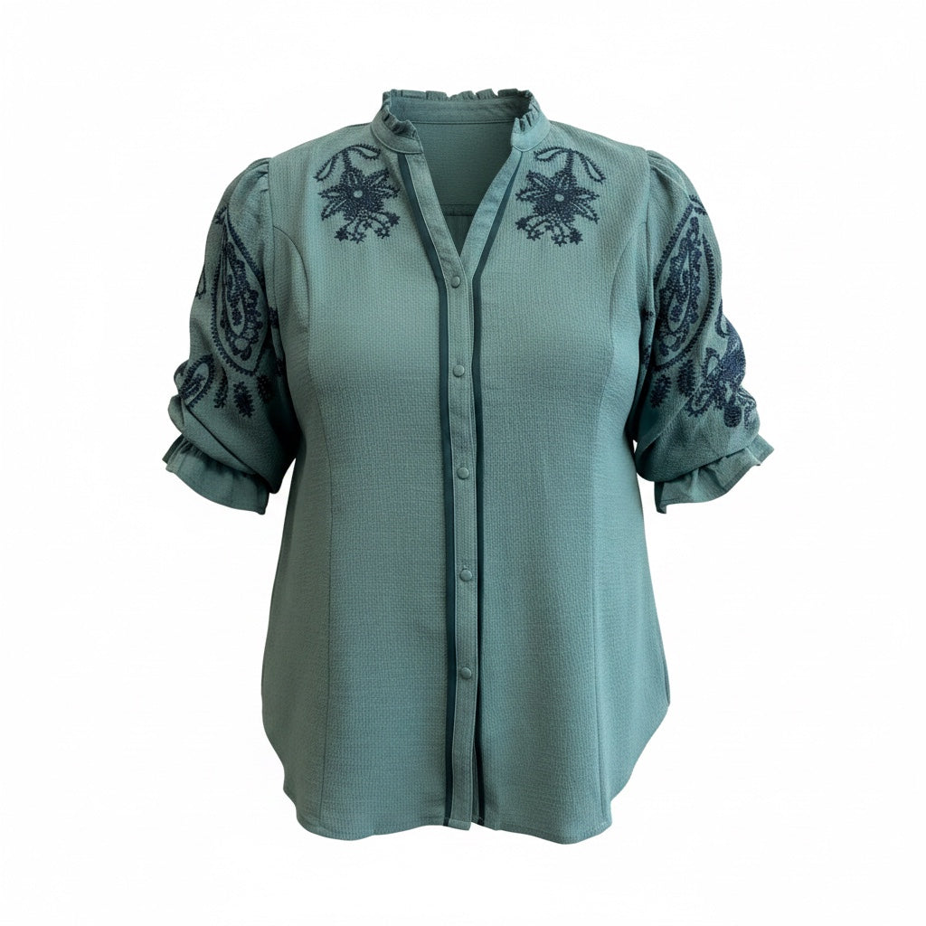 Annie Ks Boutique curvy lagoon blue top featuring delicate dark embroidery and soft ruffle sleeve accents