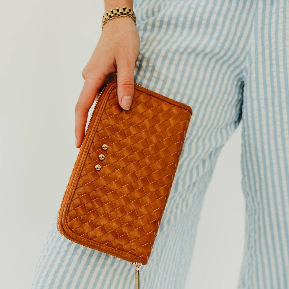 Annie Ks Boutique Lenni large zip-around wallet in woven brown vegan leather held as a clutch