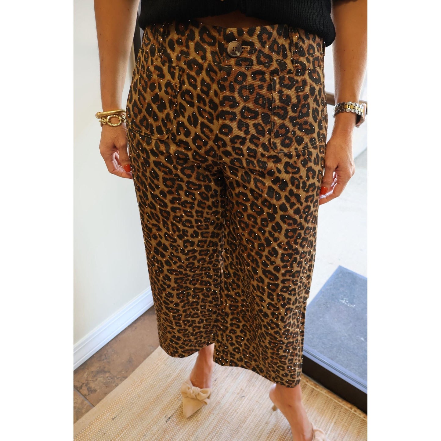 Annie Ks Boutique mocha leopard print cotton cropped pants with subtle rhinestone embellishments on a model