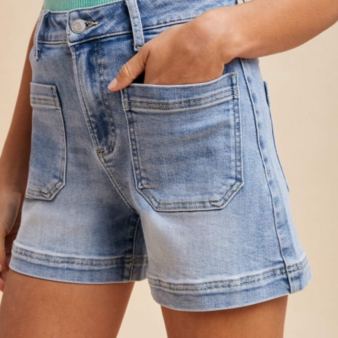 Annie Ks Boutique light wash denim utility shorts with a high-rise waist, front patch pockets, and a clean hem.