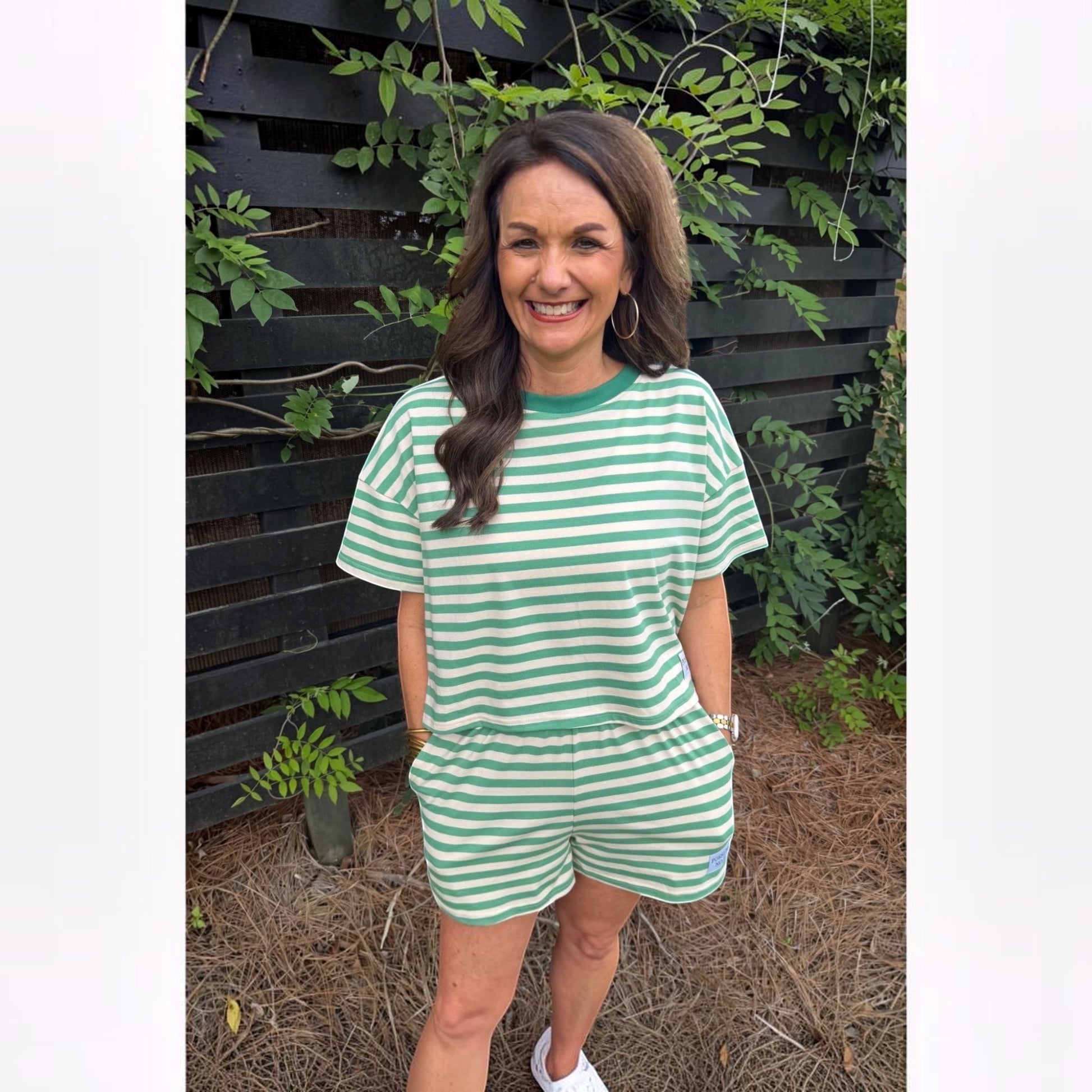 Annie Ks Boutique lime green and white striped cotton blend short set worn by a woman outdoors.