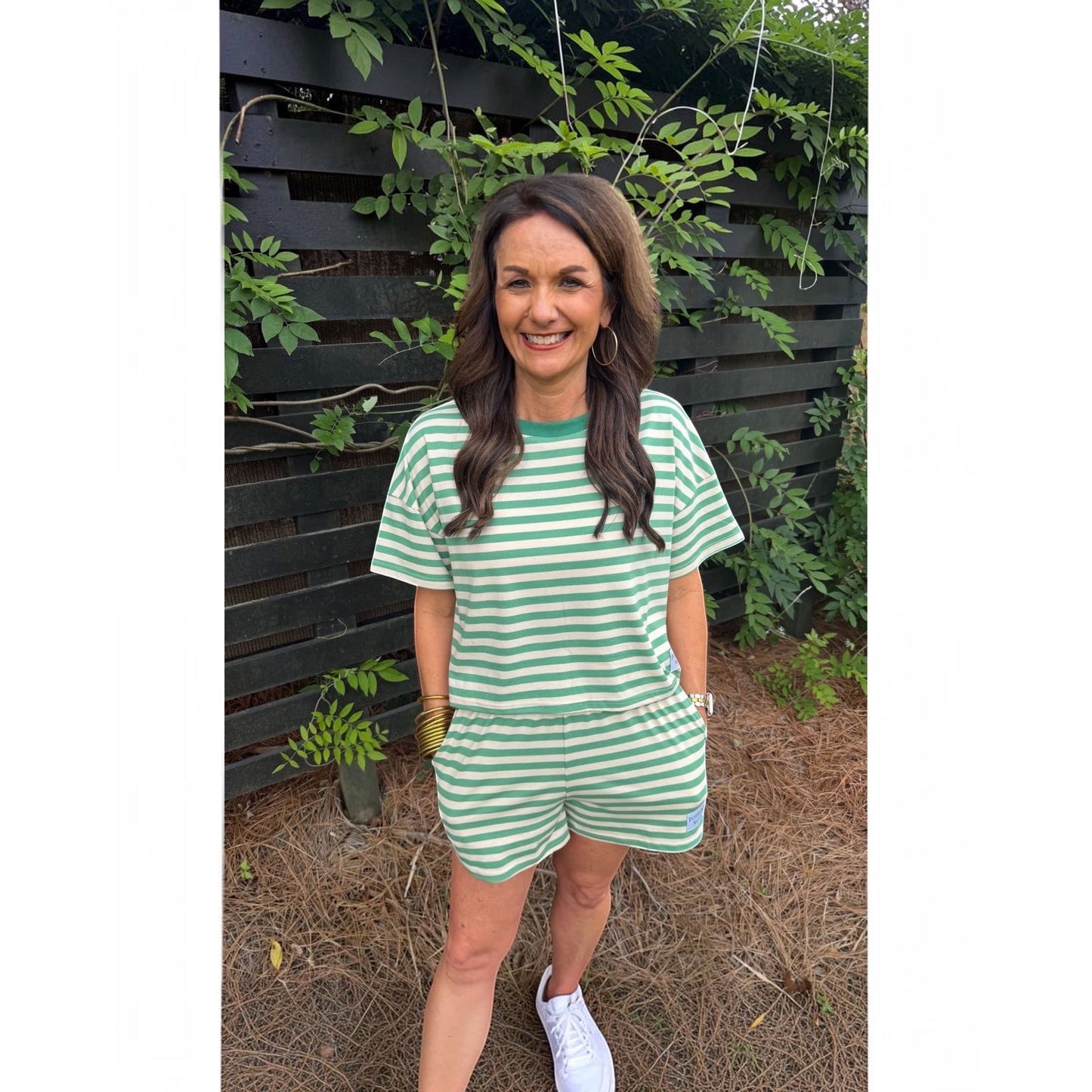 Annie Ks Boutique lime green and white striped cotton blend short set worn by a woman outdoors