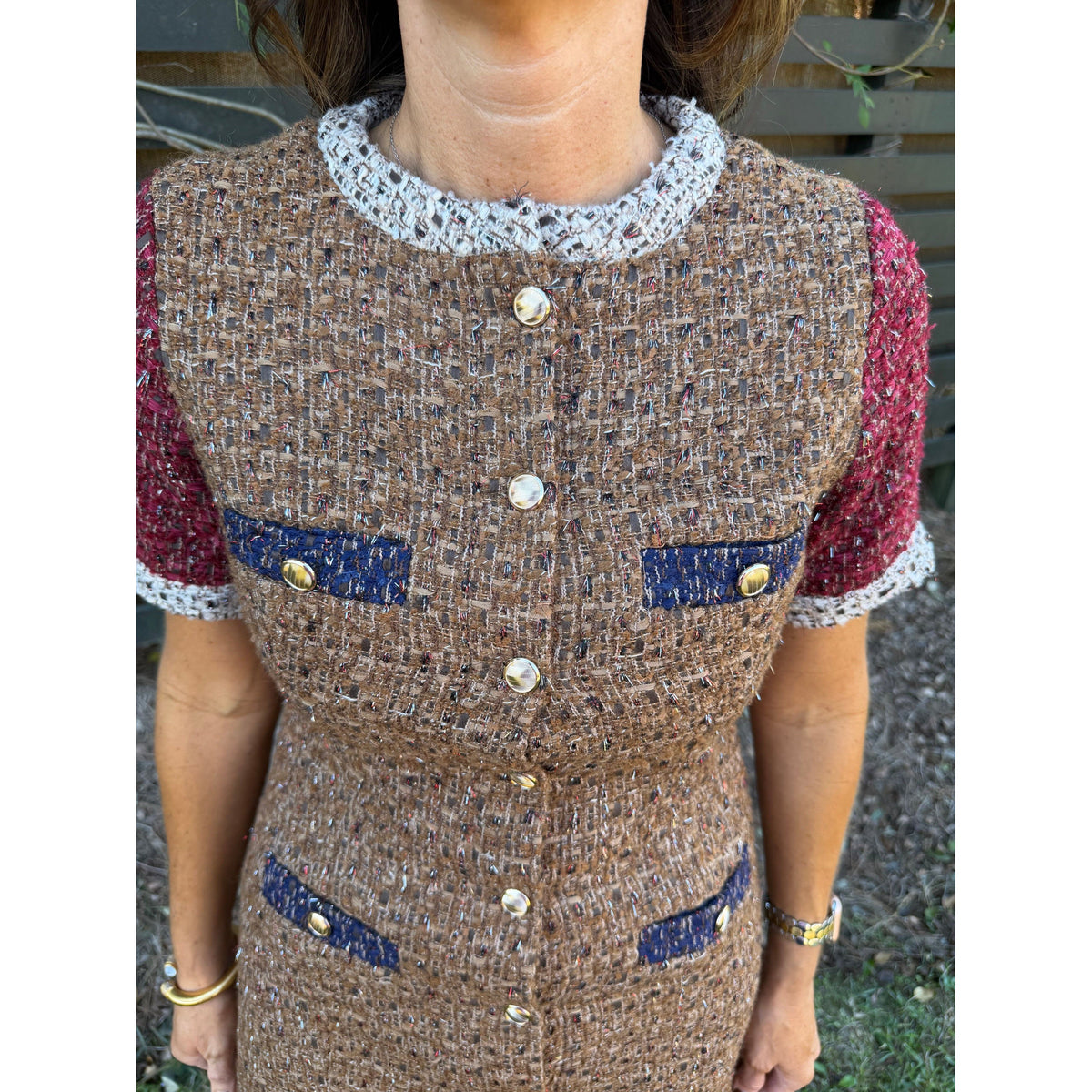 Annie Ks Boutique Lurex Mixed Tweed Dress featuring brown textured fabric, blue pocket accents, and contrast trim.