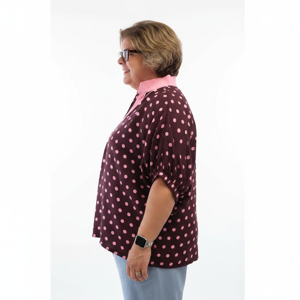 Annie Ks Boutique curvy merlot polka dot dolman top with contrast collar and elasticated sleeves on a woman
