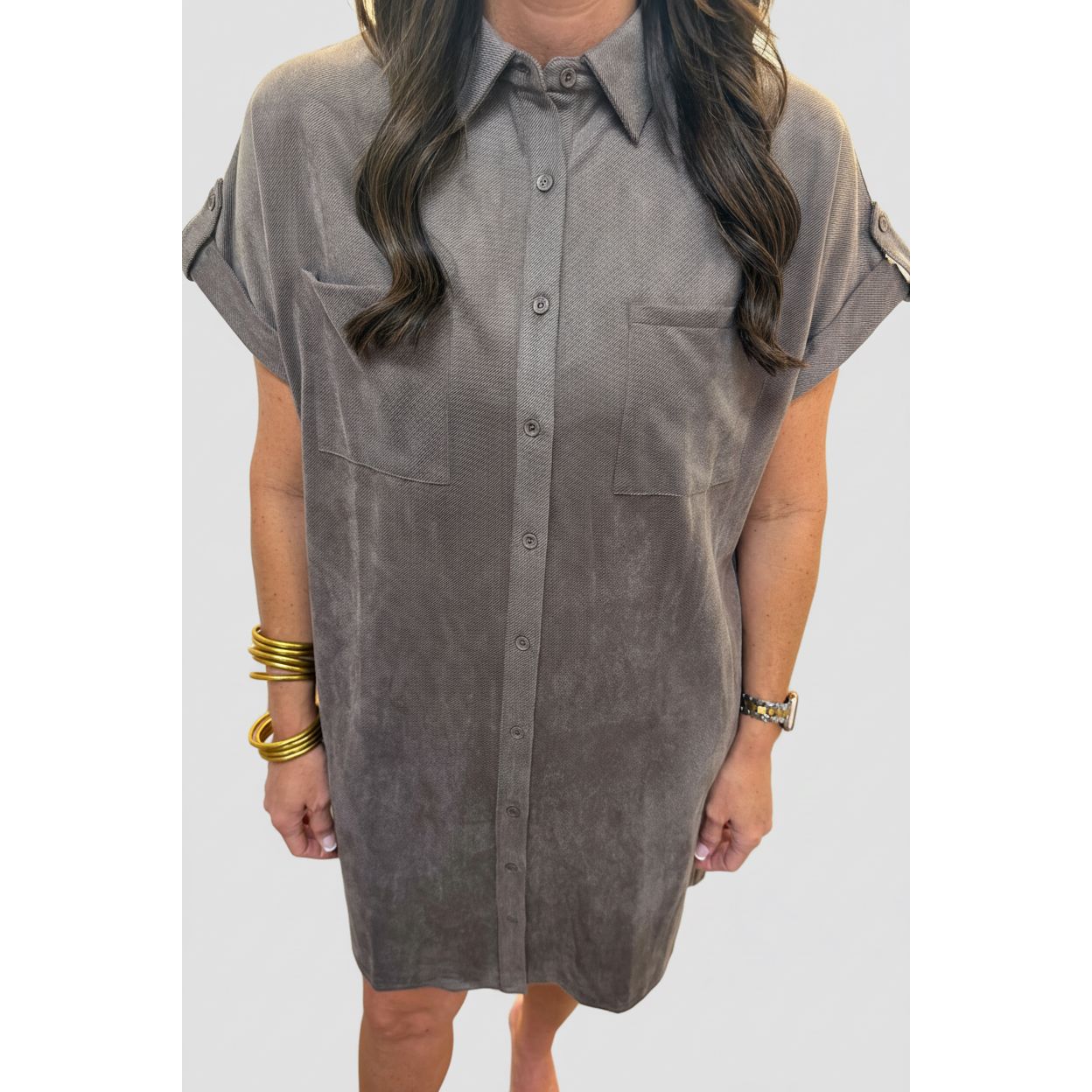 Annie Ks Boutique mocha faux suede shirt dress with button-front closure, chest pockets, and relaxed short sleeves.