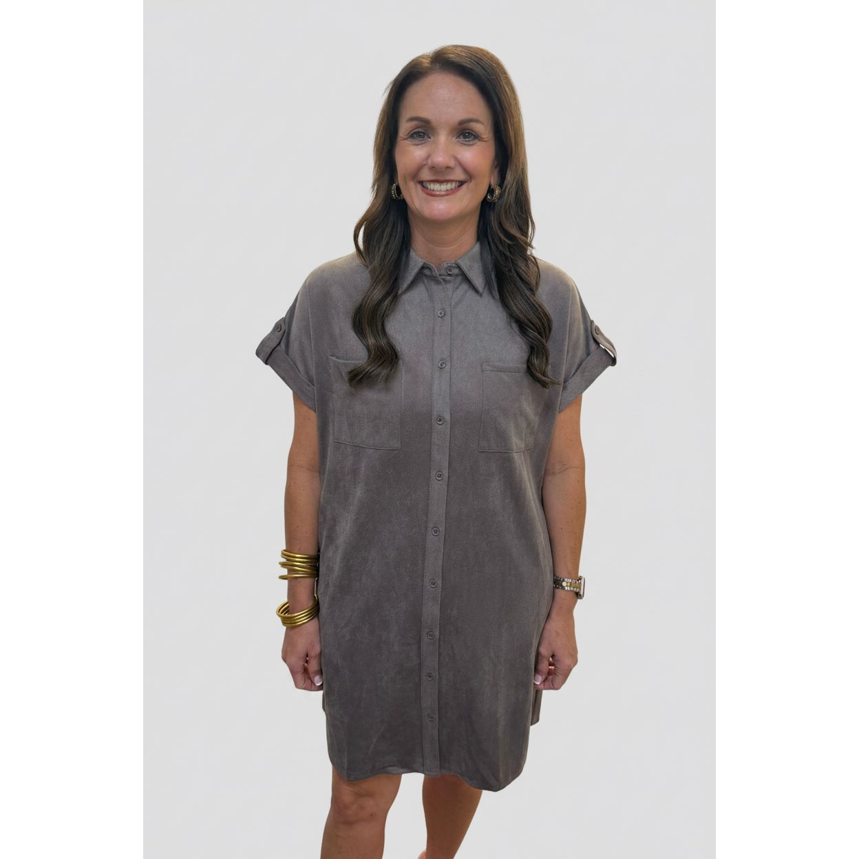 Annie Ks Boutique mocha faux suede shirt dress with button-front closure, chest pockets, and relaxed drop shoulders.