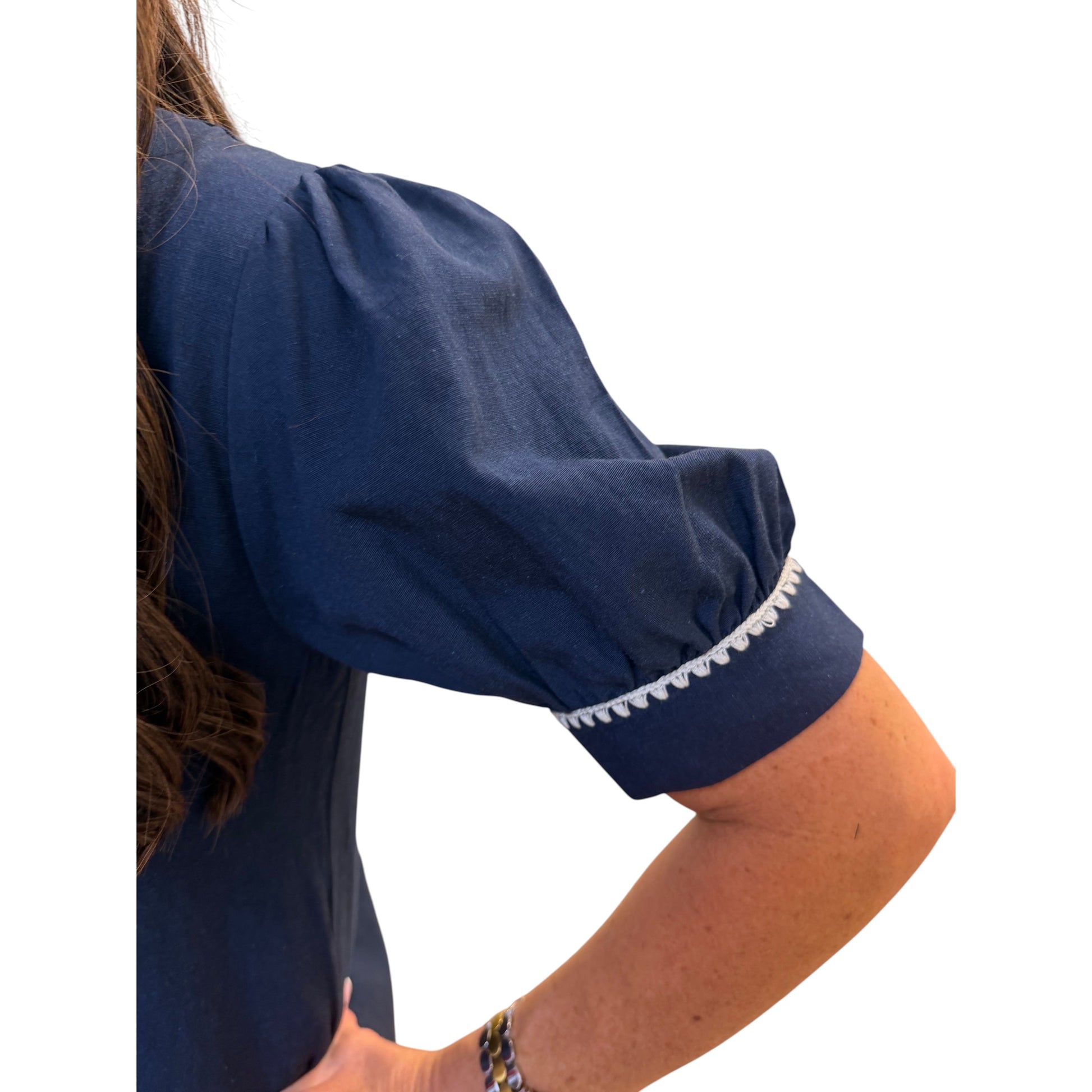 Annie Ks Boutique navy shift dress featuring puff sleeves with delicate white contrast embroidery trim