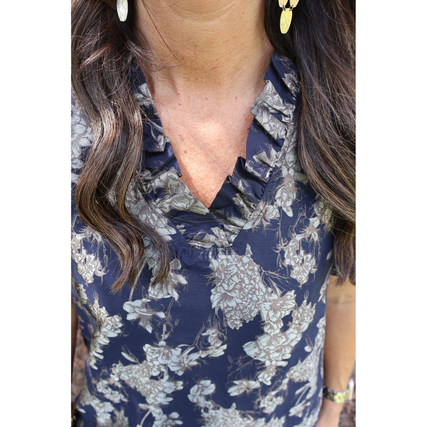 Annie Ks Boutique navy floral jacquard dress with a ruffled V-neckline and textured fabric detail.