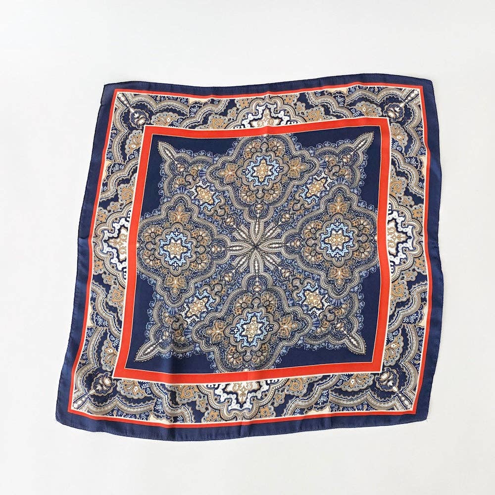 Annie Ks Boutique Alice square scarf in navy and rust with a detailed geometric paisley pattern on soft fabric.