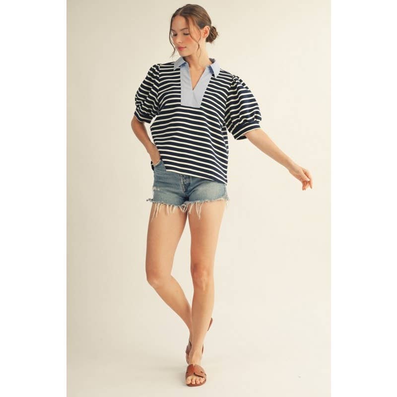 Annie Ks Boutique navy striped knit top with a light blue contrast collar, V-neck, and puff sleeves on a model.