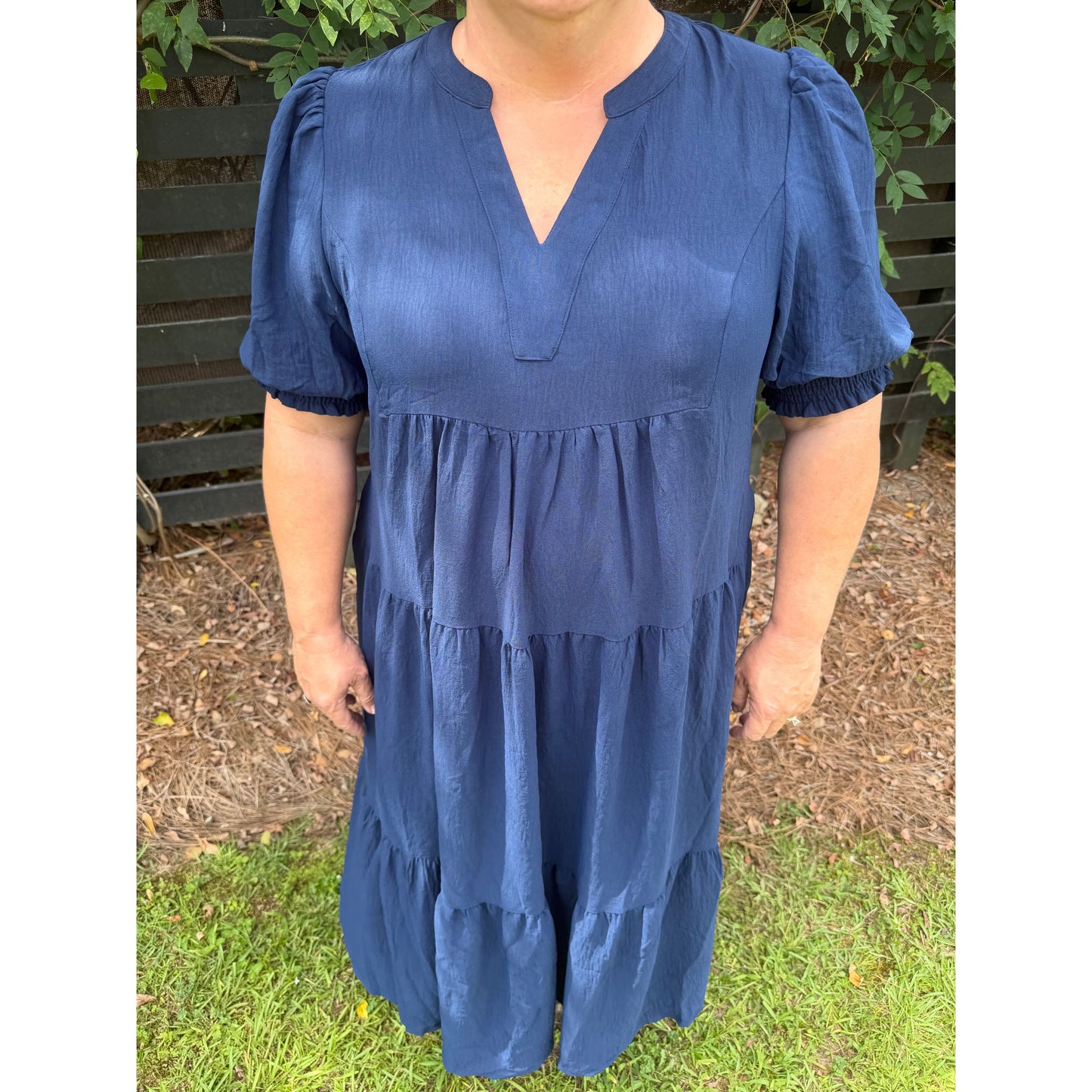 Annie Ks Boutique navy midi dress with V-neckline and voluminous 3/4 puff sleeves in a tiered silhouette