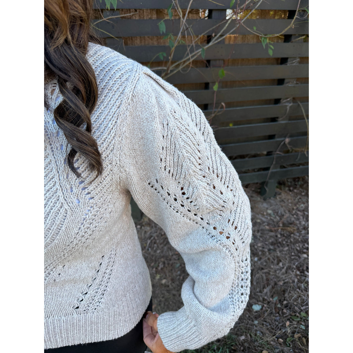 Annie Ks Boutique oatmeal cable knit cardigan featuring chevron pointelle openwork and gathered volume sleeves.