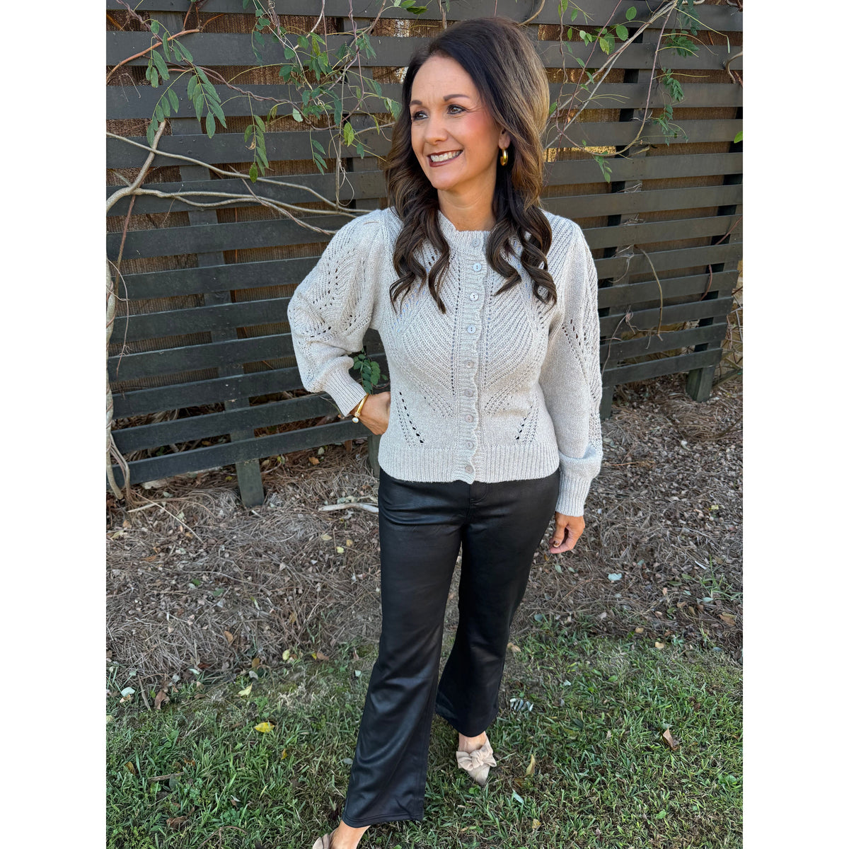 Annie Ks Boutique oatmeal cable knit cardigan with chevron pointelle details and volume sleeves worn with black pants