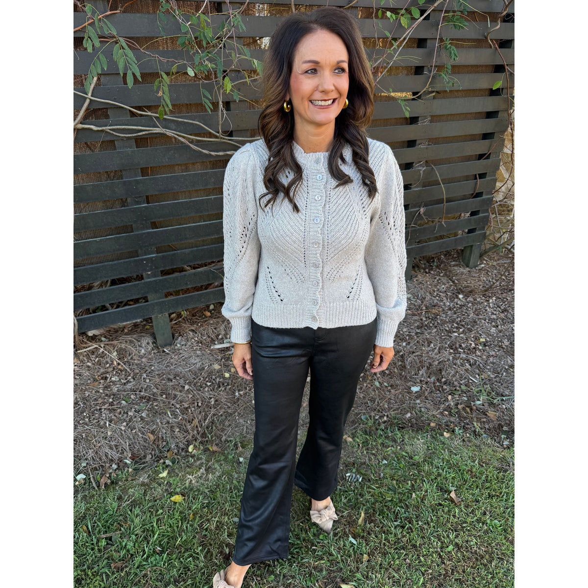 Annie Ks Boutique oatmeal cable knit cardigan with chevron pointelle detailing and volume sleeves worn with black pants