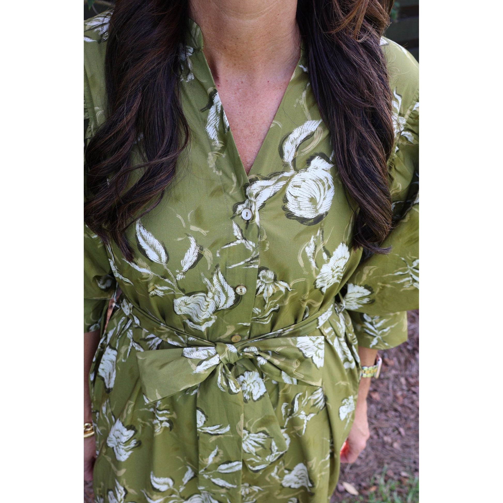 Annie Ks Boutique golden olive cotton midi dress with a floral print, V-neckline, button-down front, and waist tie.