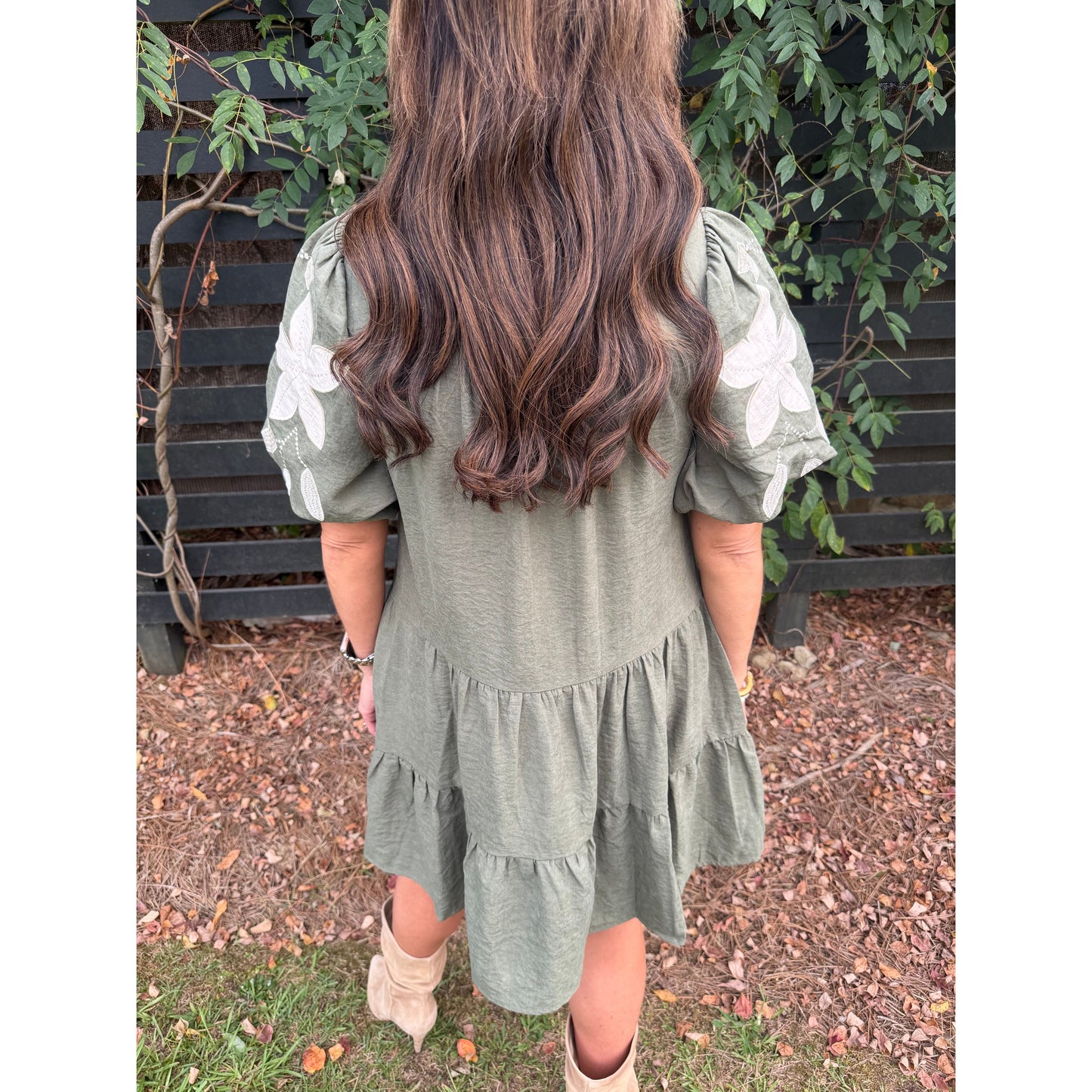 Annie Ks Boutique olive tiered mini dress with puff sleeves and white floral applique embroidery, back view