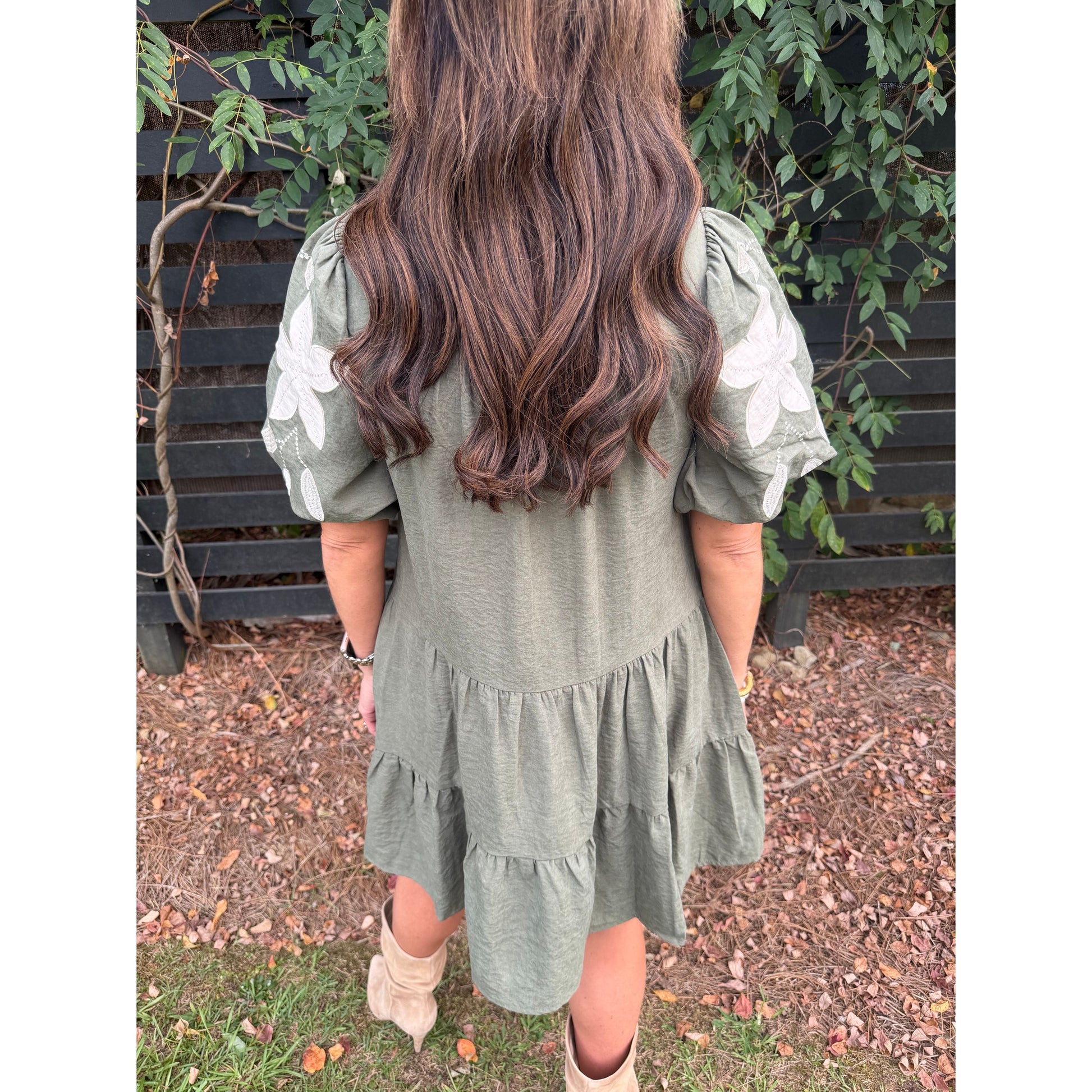 Annie Ks Boutique olive tiered mini dress with puff sleeves and white floral applique embroidery, back view