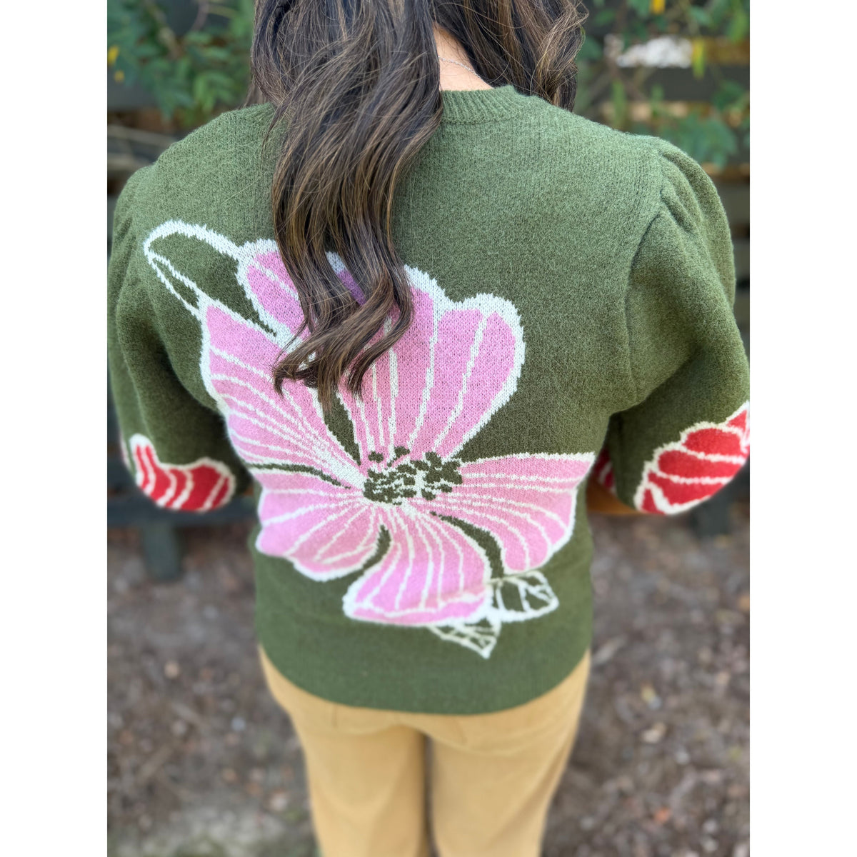 Annie Ks Boutique olive sweater with large pink floral print and structured puff sleeves, back view