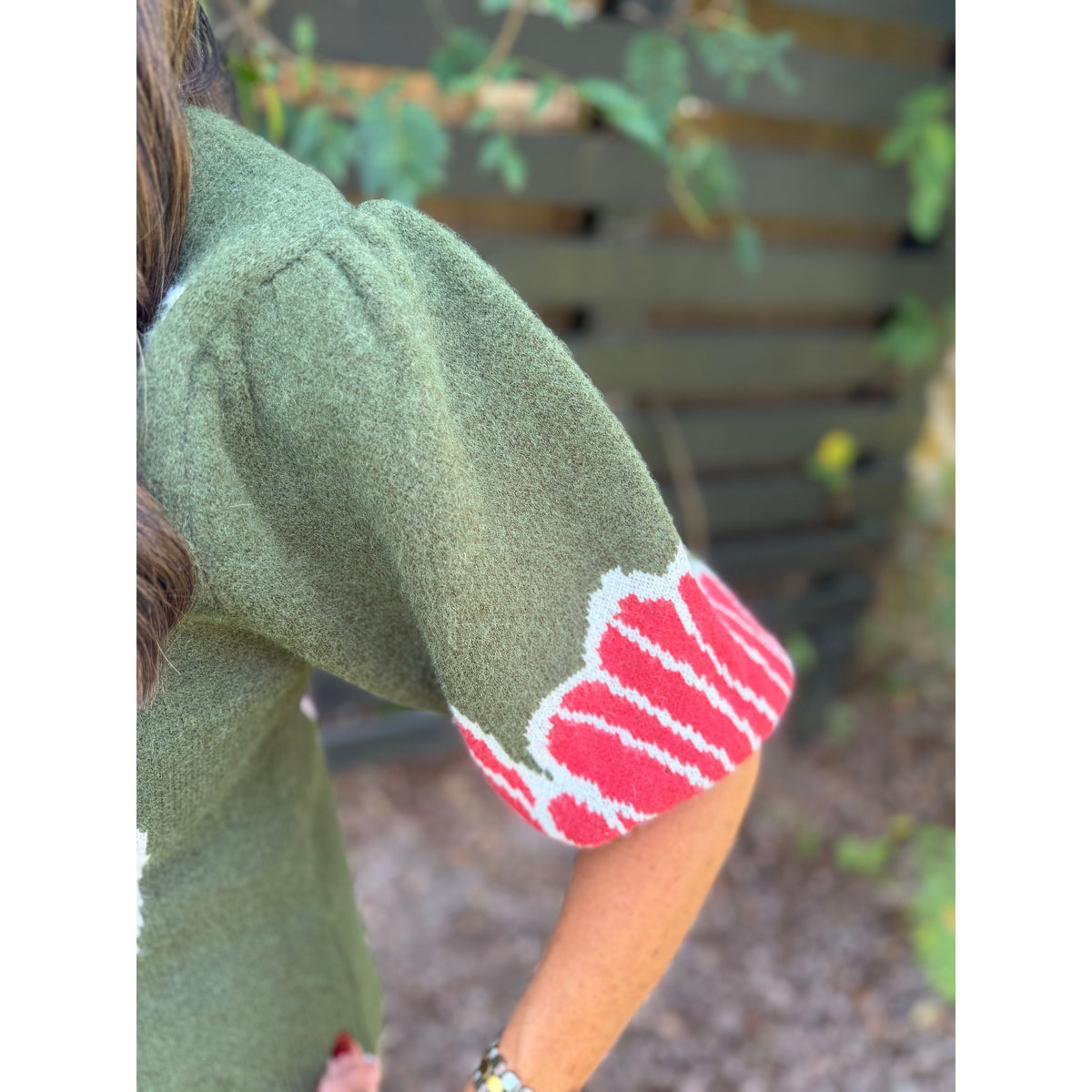 Annie Ks Boutique olive sweater with puff sleeves and red floral detail on the sleeve cuff