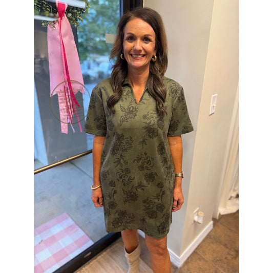 Annie Ks Boutique olive faux suede mini dress with a floral print, structured collar, and short sleeves on a woman.