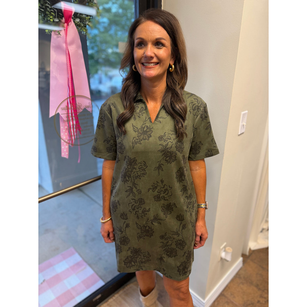 Annie Ks Boutique olive faux suede mini dress with black floral print, structured collar, and short sleeves.