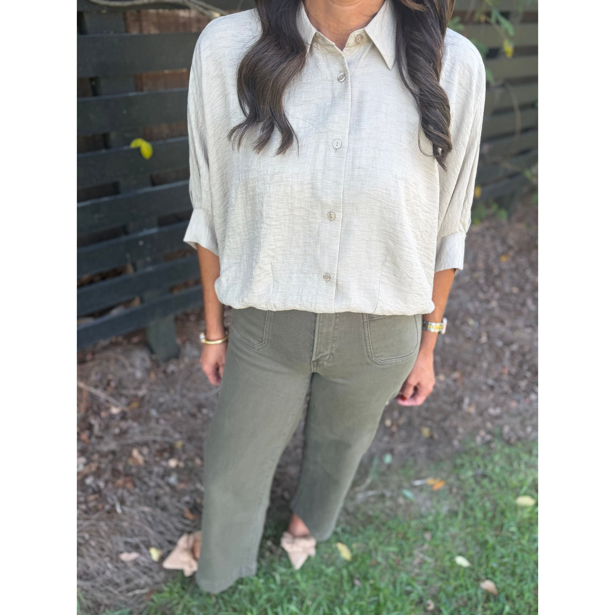 Annie Ks Boutique Nandor high-rise wide leg crop pants in olive green paired with a light beige button-down shirt