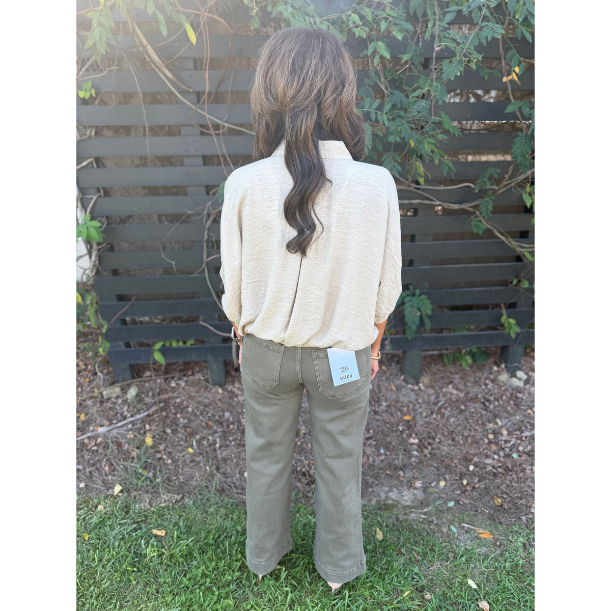 Annie Ks Boutique Nandor high-rise wide leg crop pants in olive green cotton-stretch blend worn by a woman
