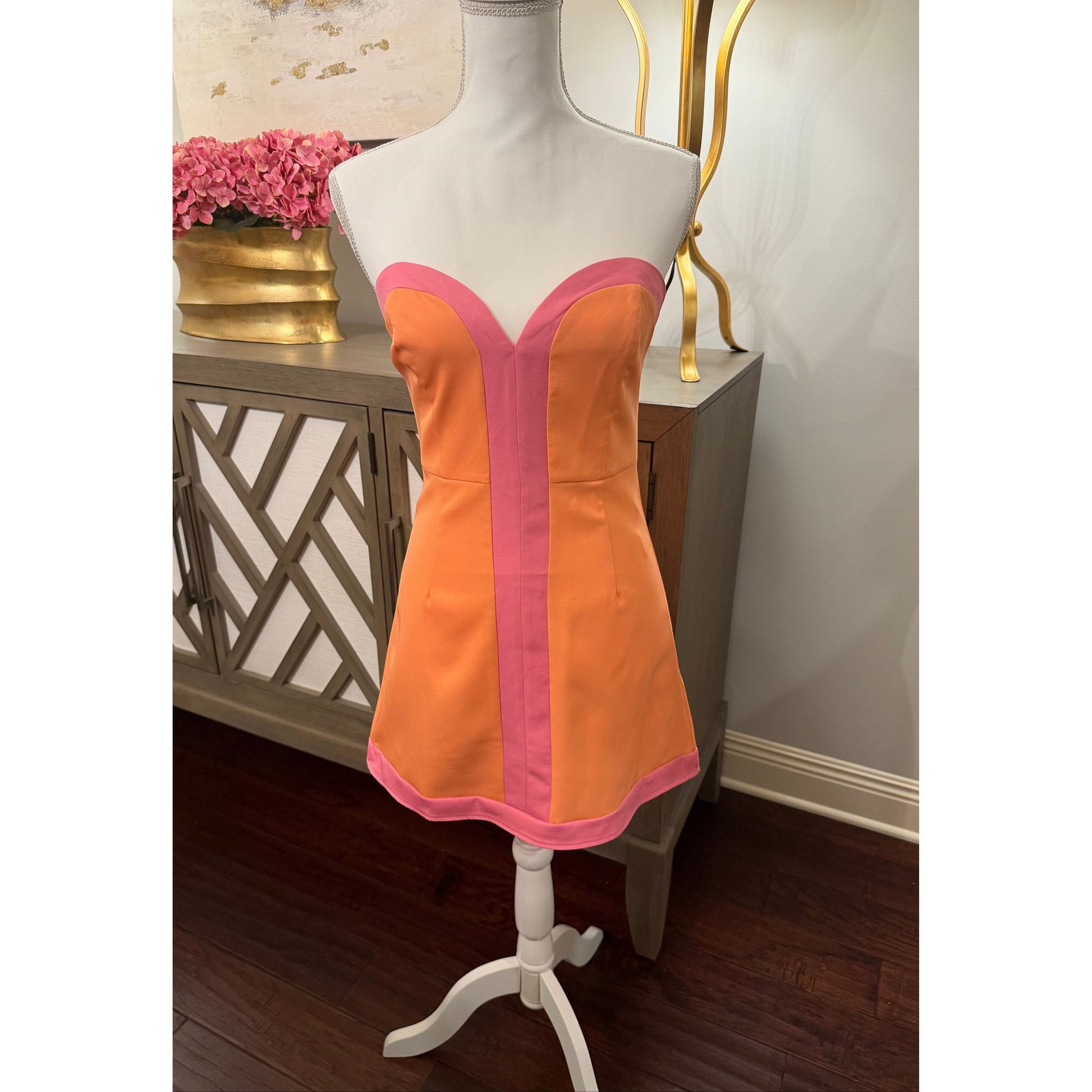 Annie Ks Boutique strapless colorblock romper dress in peach and pink with sweetheart neckline and structured bodice.