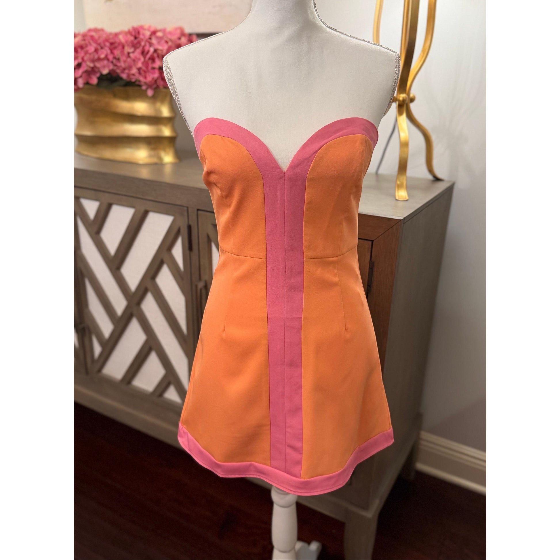 Annie Ks Boutique peach and pink strapless colorblock romper dress with sweetheart neckline and structured bodice.