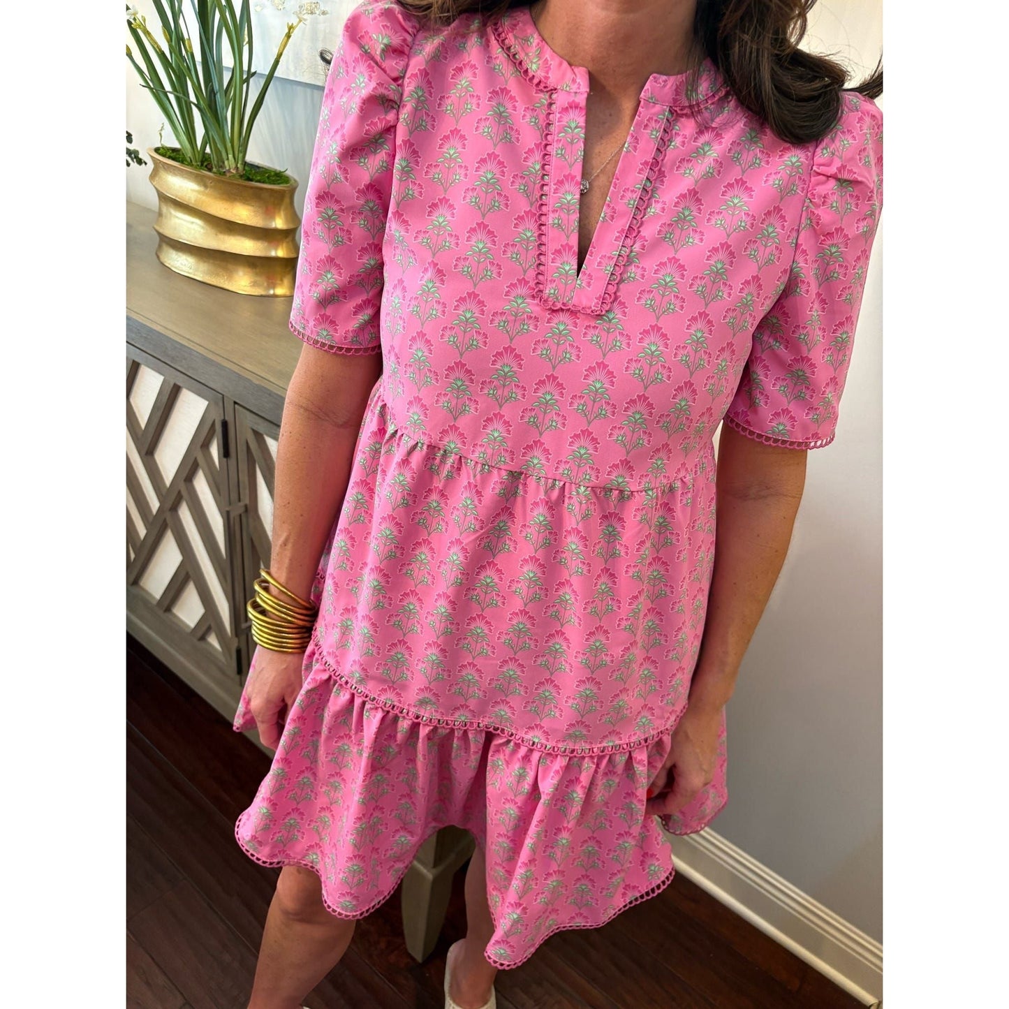 Annie Ks Boutique pink floral mini dress with split V-neck, puff sleeves, scallop trim, and side pockets.