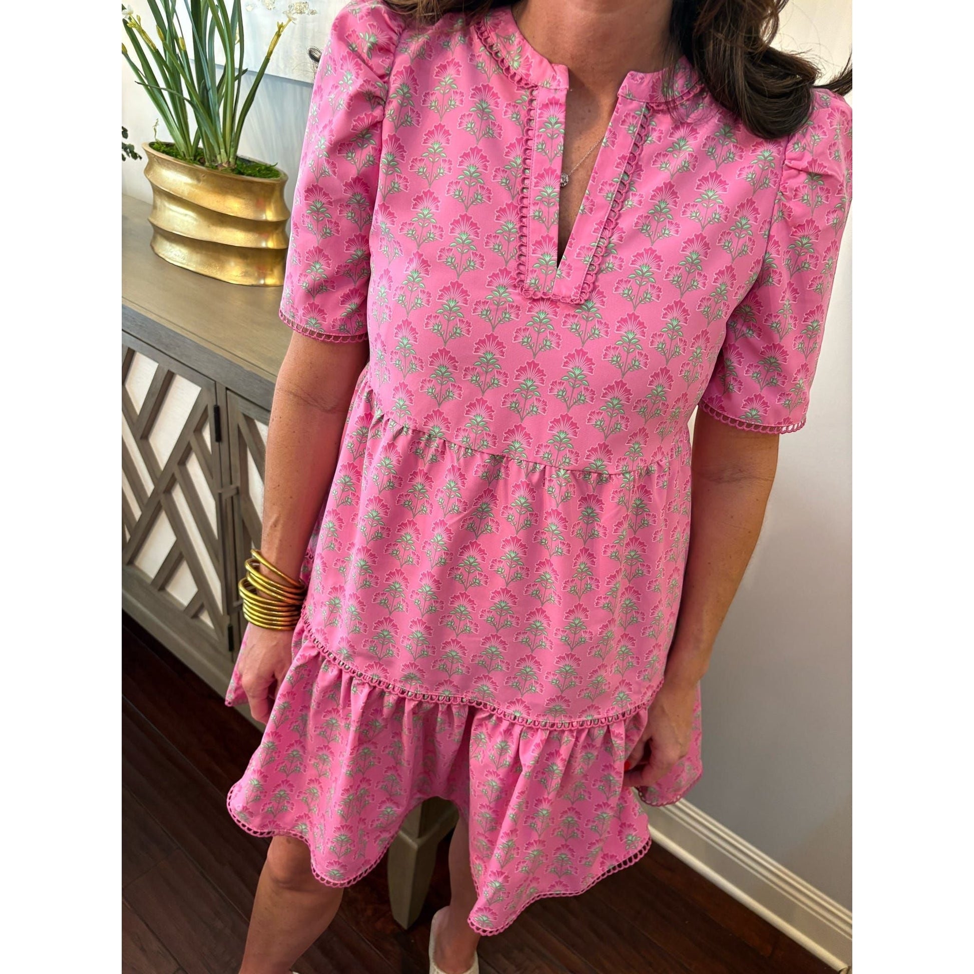 Annie Ks Boutique pink floral mini dress with split V-neck, puff sleeves, scallop trim, and side pockets.