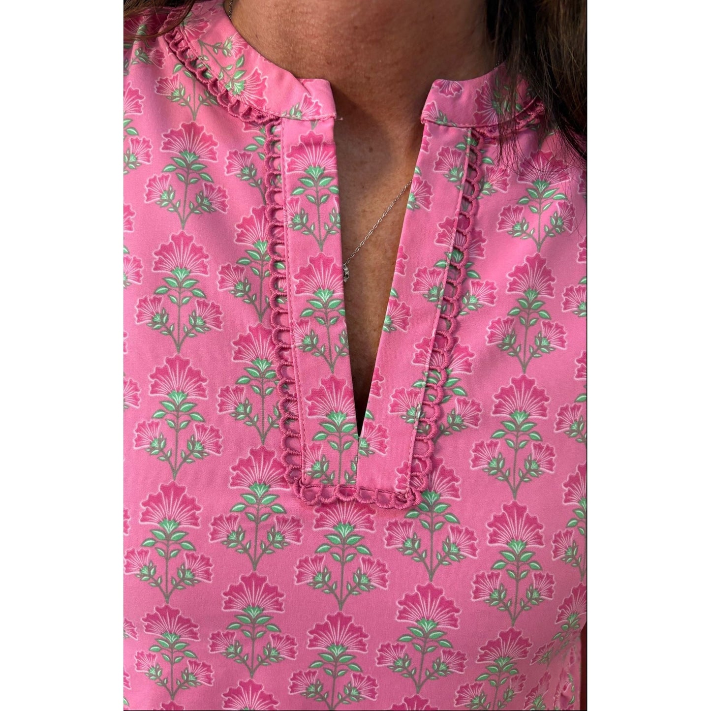 Annie Ks Boutique Adelyn mini dress in pink with a floral print, split V-neckline, and delicate scallop trim.