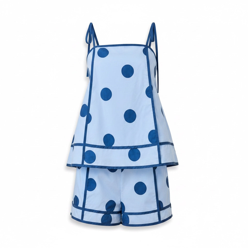 Annie Ks Boutique light blue and dark blue polka dot swing cami and high-waisted shorts set with contrast trim.