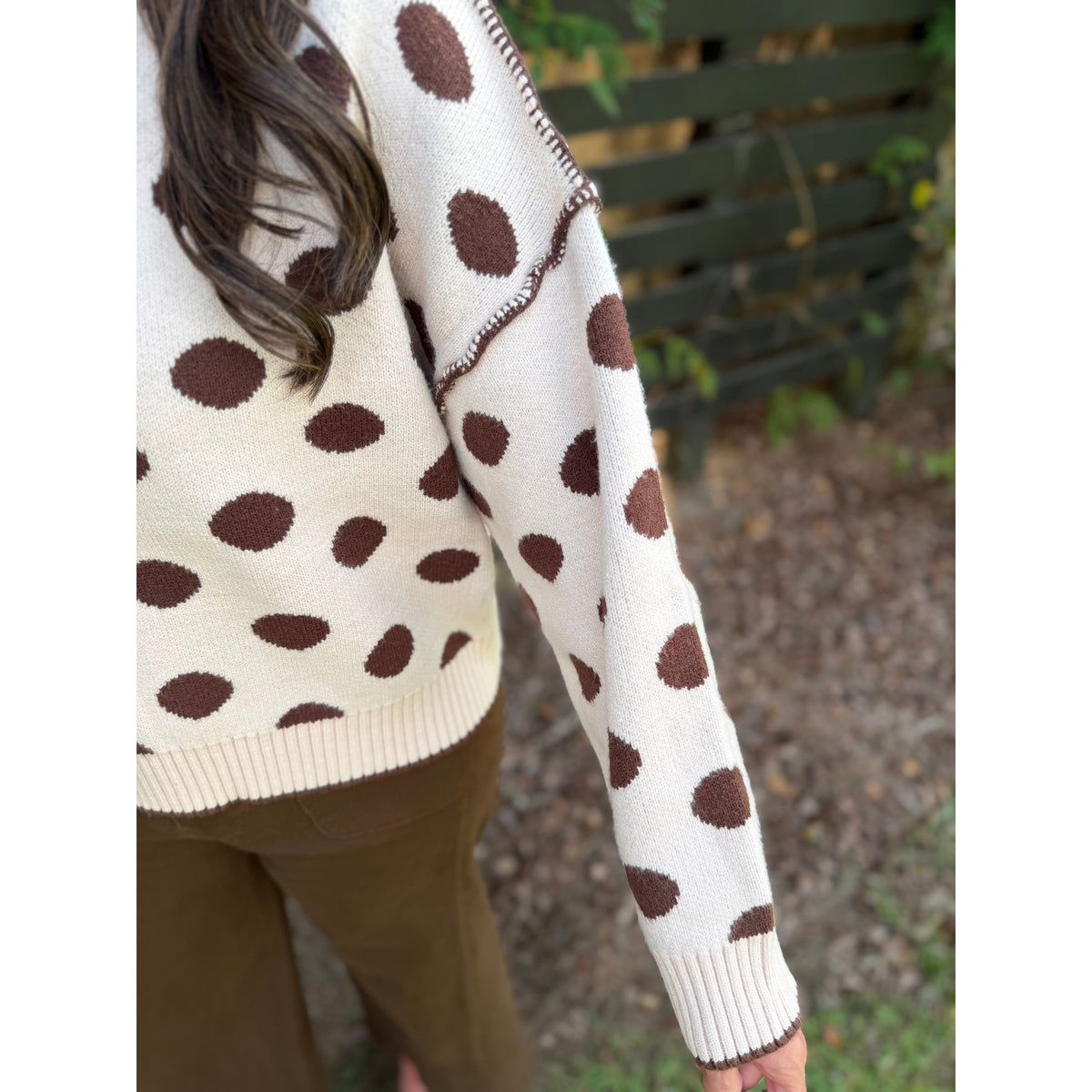 Annie Ks Boutique loose fit sweater in oatmeal with coffee brown polka dots and exposed seam detail