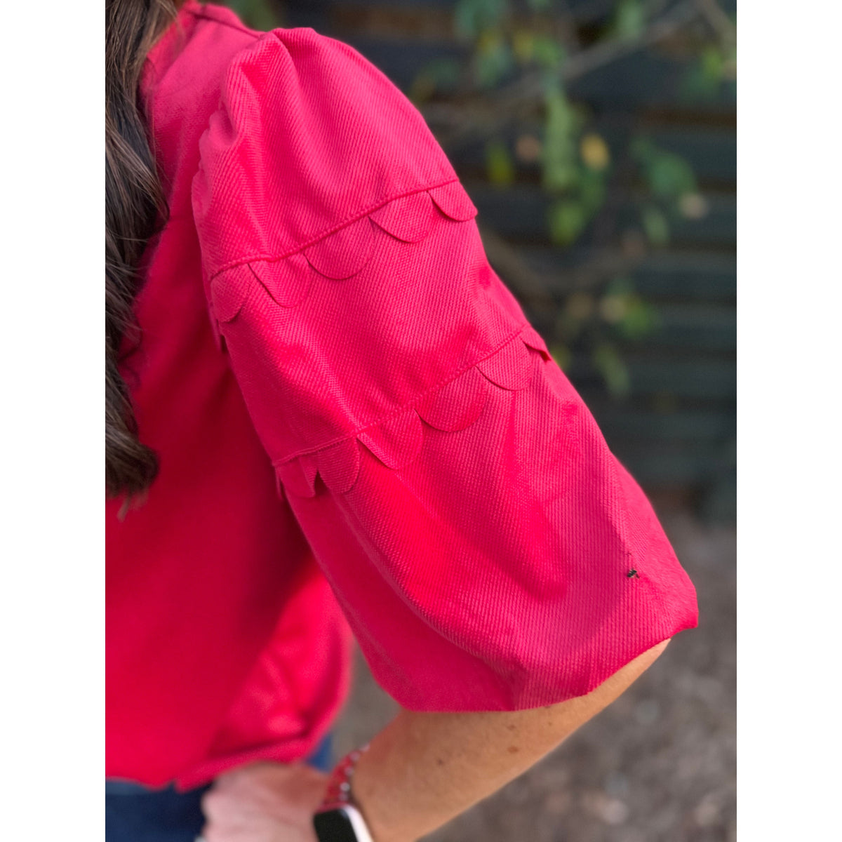 Annie Ks Boutique red corduroy top featuring architectural bubble sleeves with layered scalloped trim detail