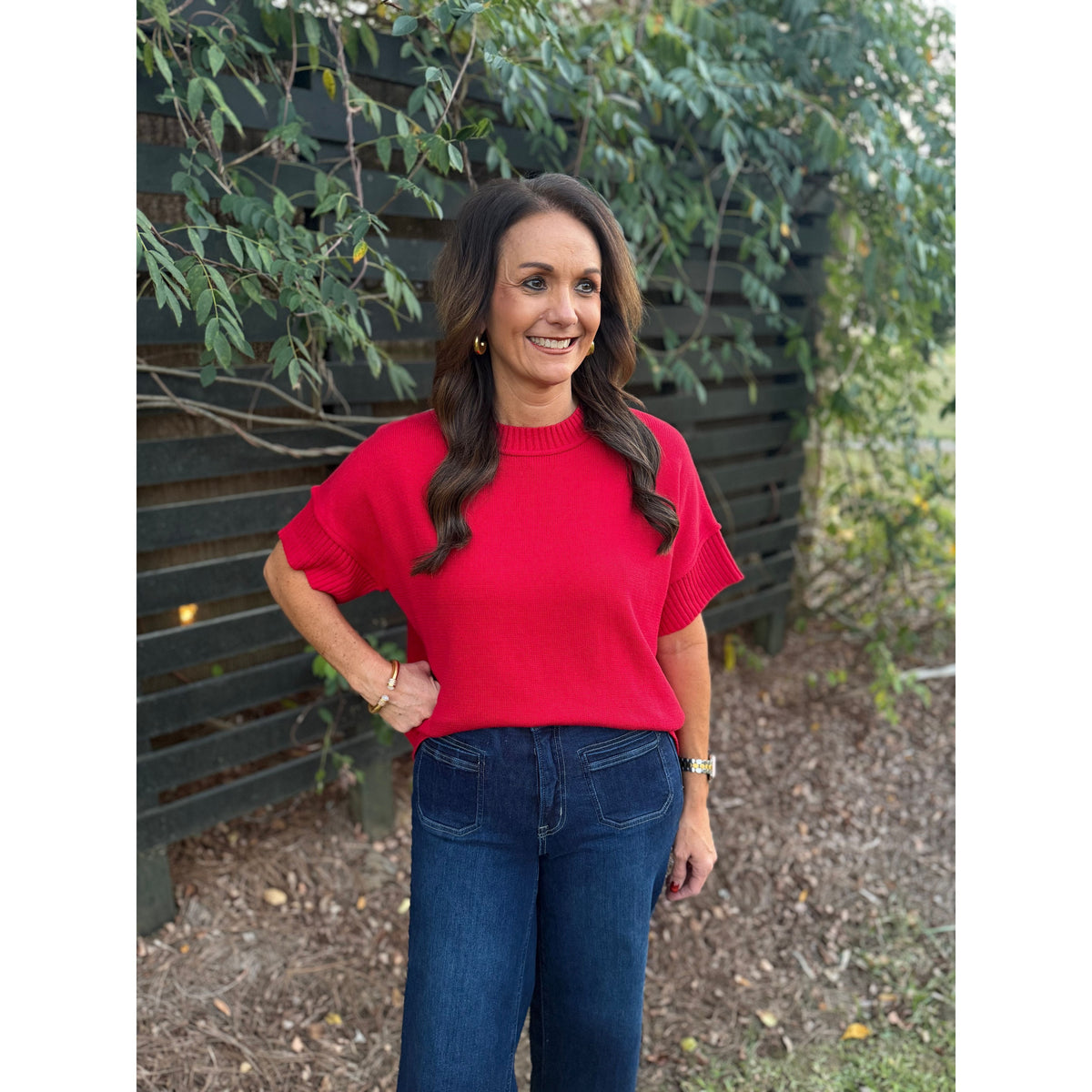 Annie Ks Boutique red crew neck sweater with drop-shoulder half sleeves worn by a woman with dark wavy hair