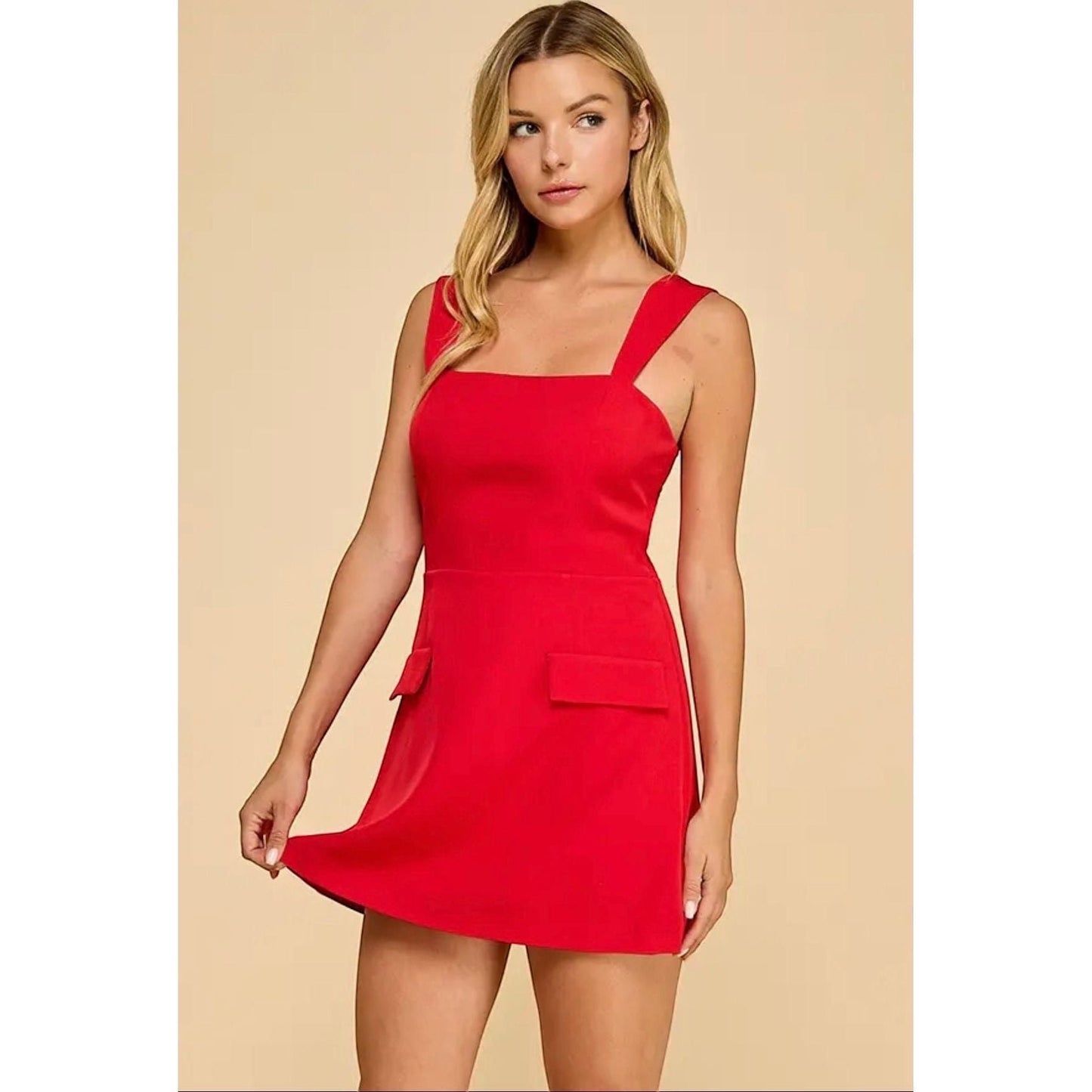 Annie Ks Boutique red mini skort romper with a straight neckline, wide straps, and faux flap pockets.