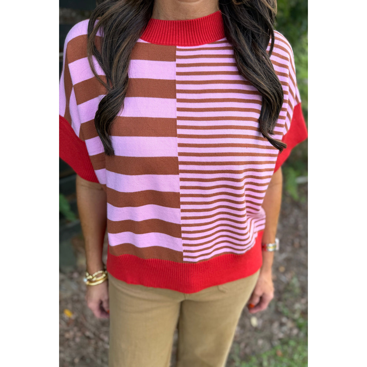 Annie Ks Boutique rust and pink striped drop-shoulder sweater with a mock neck and relaxed fit.