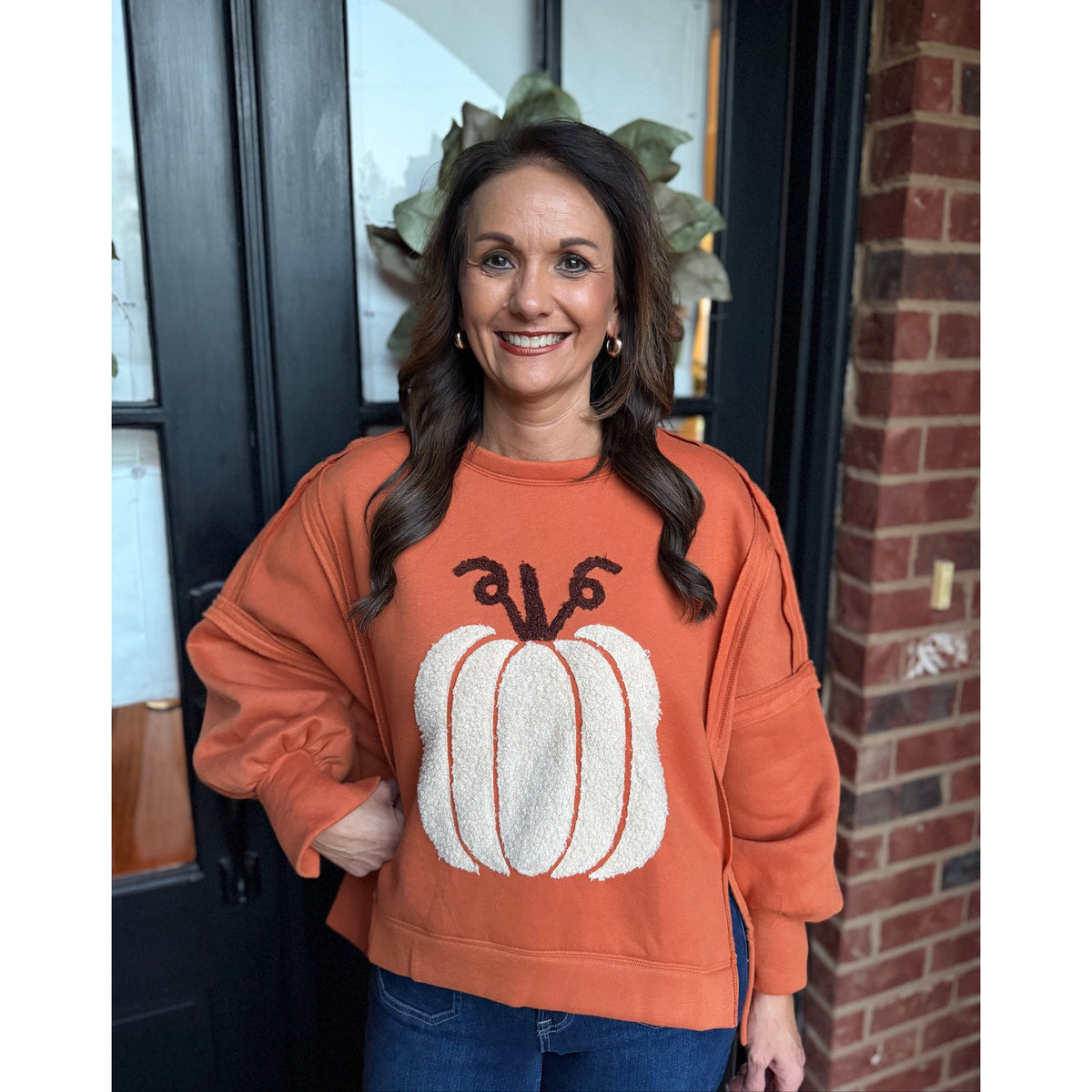 Annie Ks Boutique vintage rust pullover with a textured white pumpkin patch, drop shoulders, and side slits.