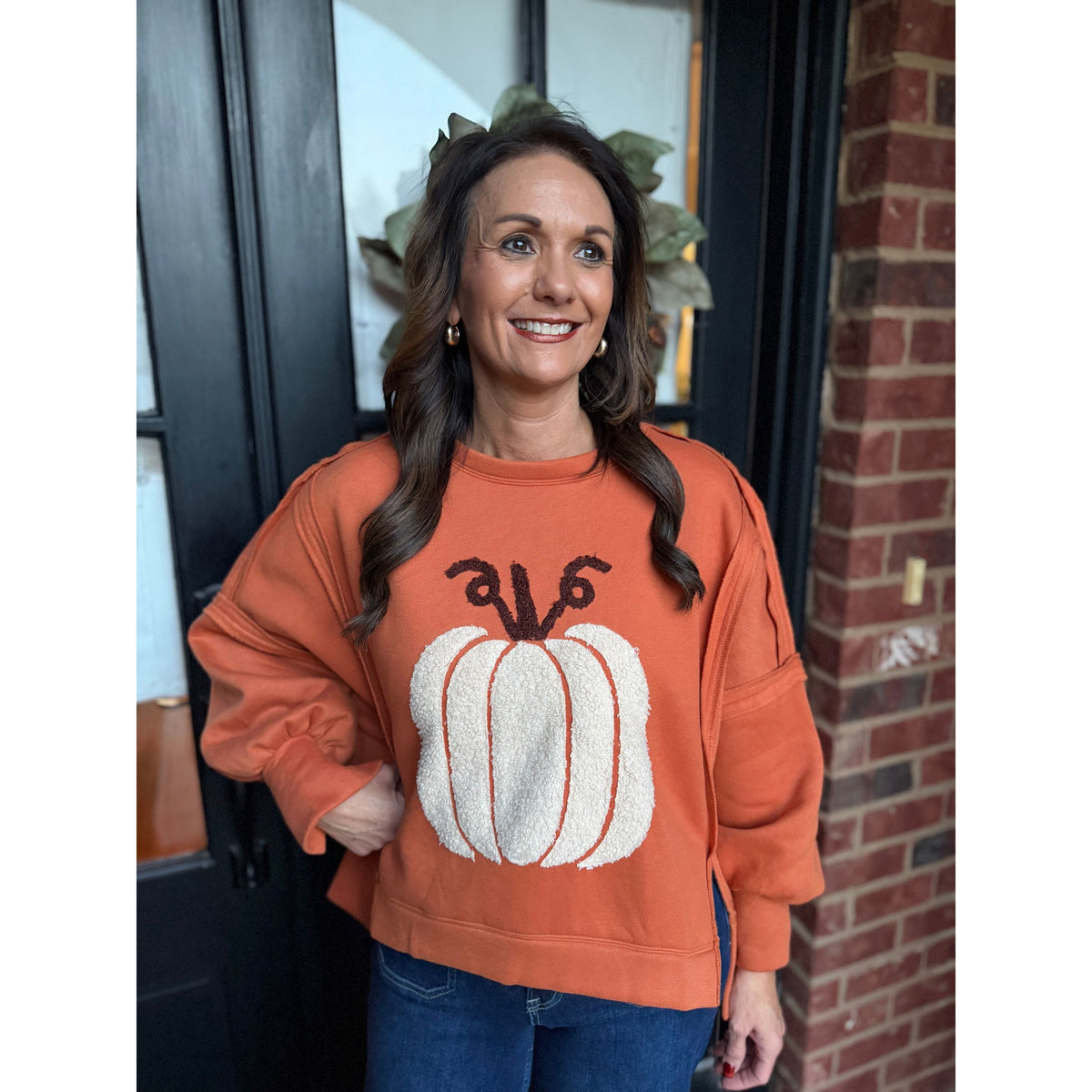 Annie Ks Boutique vintage rust pullover with a textured white pumpkin patch, drop shoulders, and side slits.